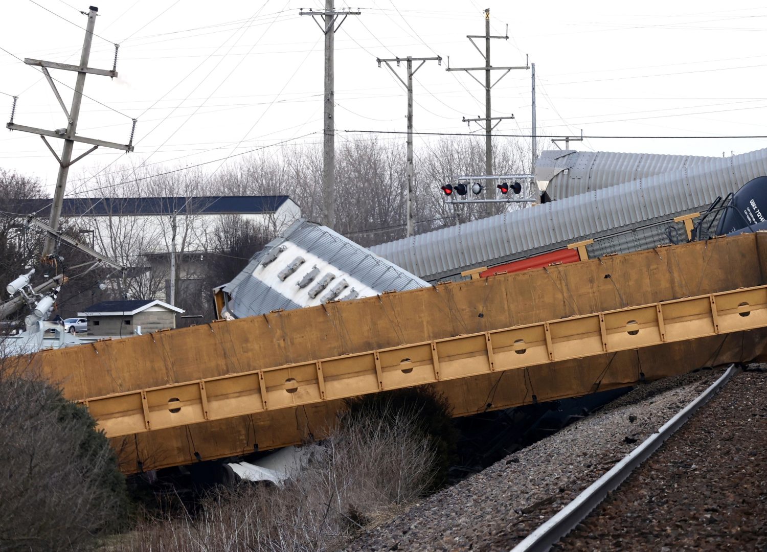 FILE - Multiple cars of a Norfolk Southern train lie toppled on one another after derailing at a train crossing near Springfield, Ohio, on March 4, 2023. The Federal Railroad Administration recently completed a review of Norfolk Southern's safety culture done in the wake of the fiery Feb. 3 derailment in Ohio, and officials plan to follow up with similar investigations of all the major freight railroads over the next year. (Bill Lackey/Springfield-News Sun via AP, File)