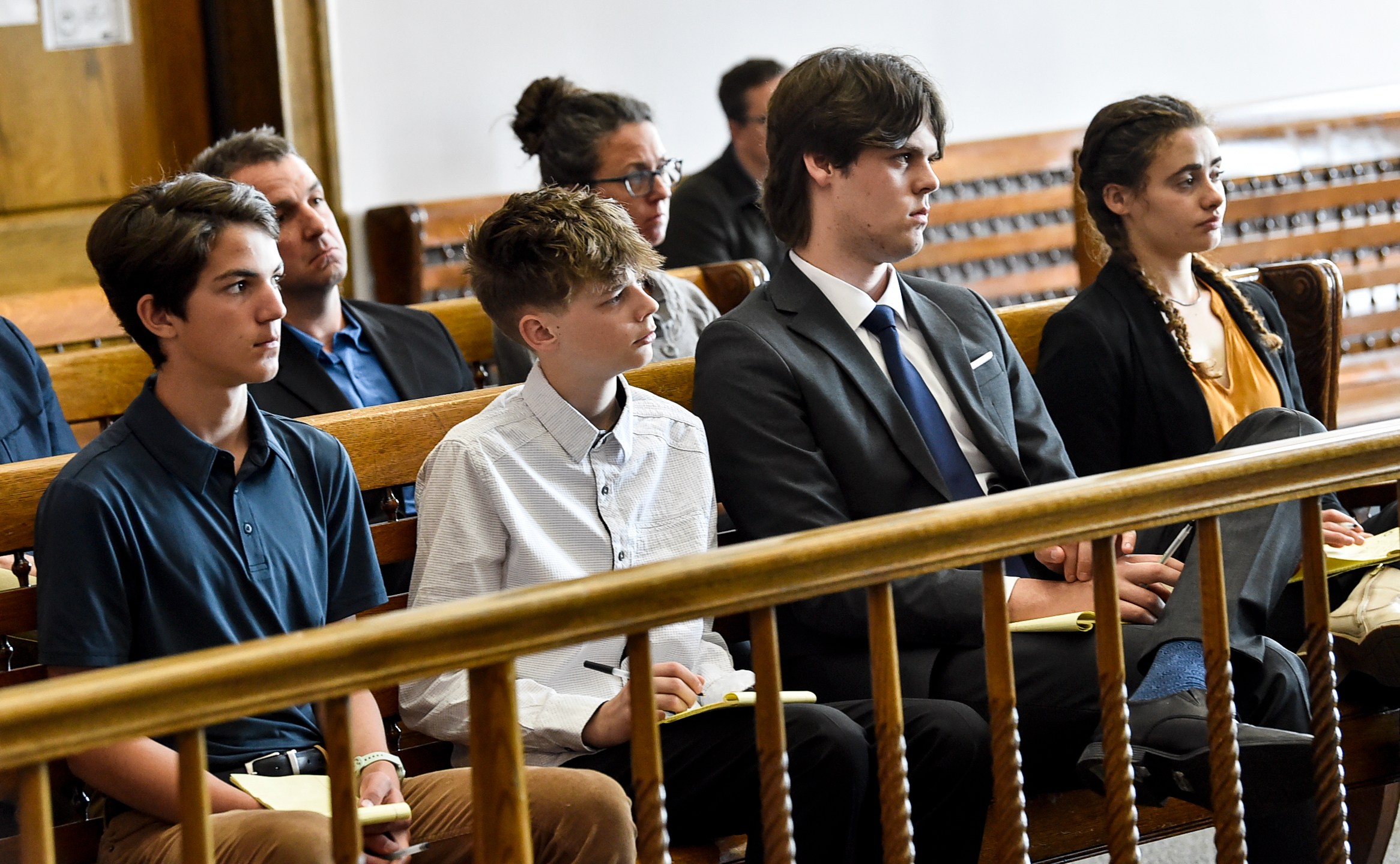 Plaintiffs Mica, 14; Badge 15, Lander 18, and Taleah, 19, listen to arguments during a status hearing on May 12, 2023, in Helena, Mont., for a case that they and other Montana youth filed against the state arguing Montana officials are not meeting their constitutional obligations to protect residents from climate change. The first-of-its-kind trial begins Monday, June 12, 2023, before District Court Judge Kathy Seeley in Helena. It is scheduled to last for two weeks. (Thom Bridge/Independent Record via AP)