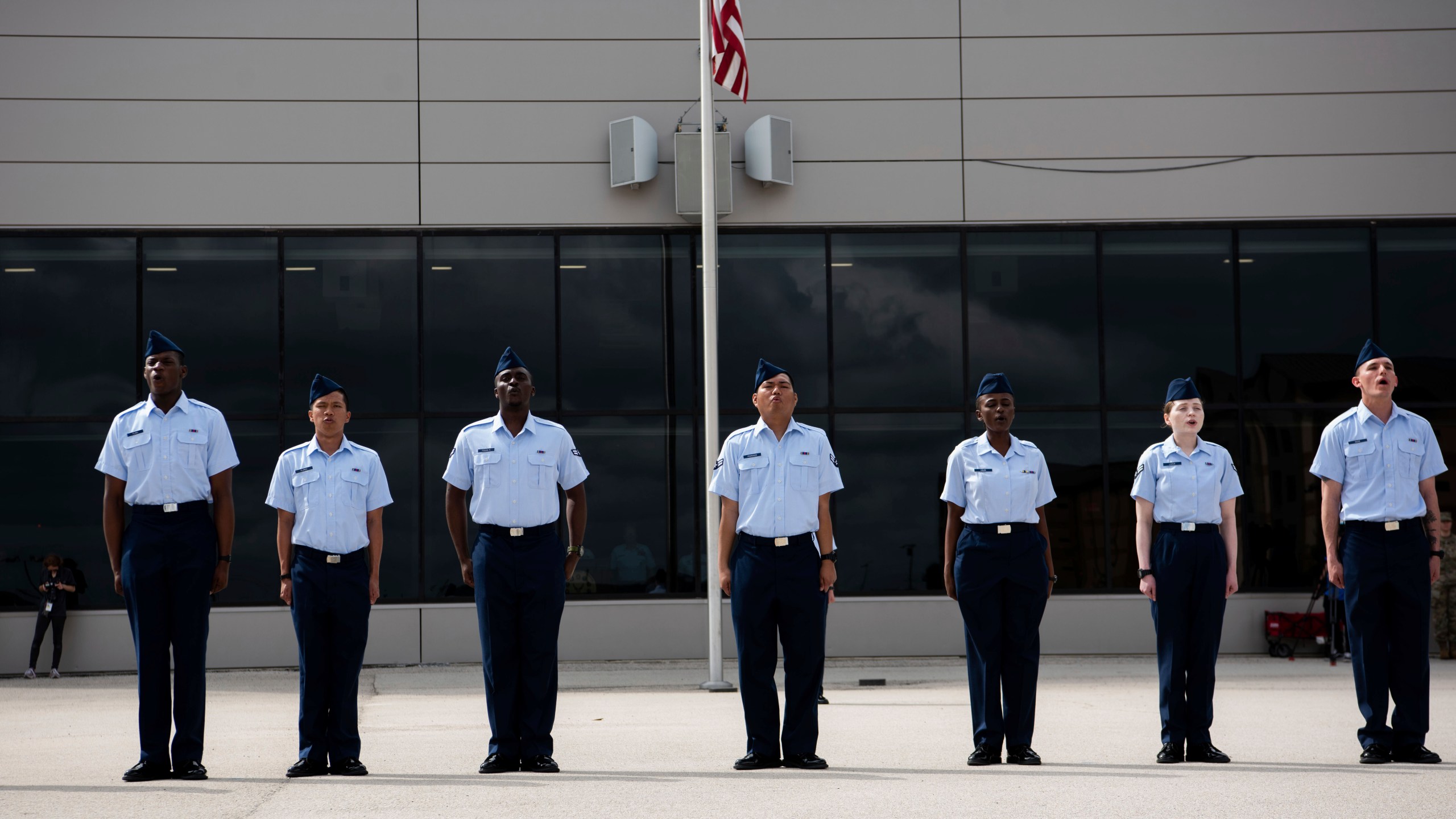 New graduates recite the Airman’s Creed at Basic Military Training during the Coin Ceremony at Joint Base San Antonio-Lackland, in San Antonio, April 26, 2023. The U.S. military has struggled to overcome recruiting shortfalls and as a way to address that problem, it's stepping up efforts to sign up immigrants, offering a fast track to American citizenship to those who join the armed services. The graduates were part of the first group of 14 who graduated from basic training and were sworn in as new citizens under the new initiative. (Vanessa R. Adame/U.S. Air Force via AP)