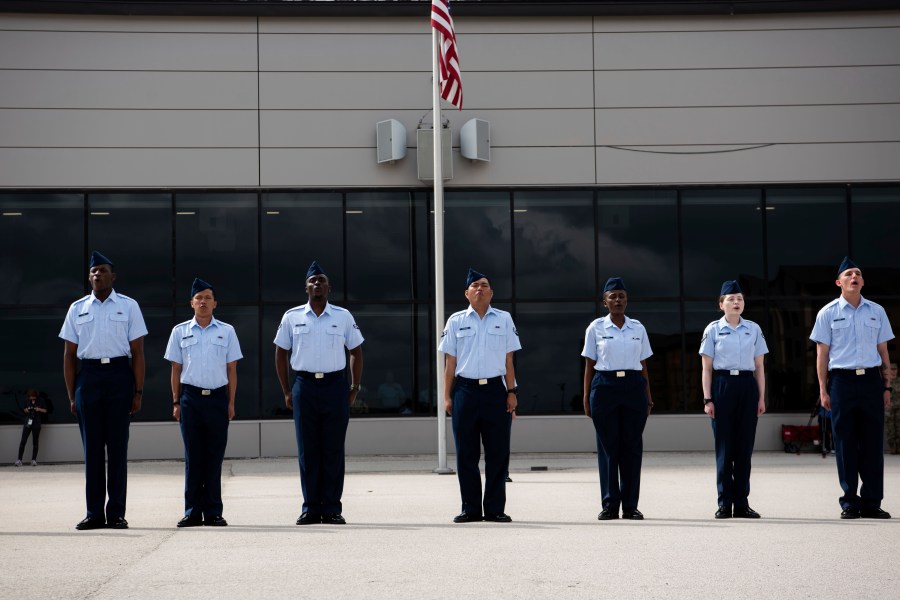 New graduates recite the Airman’s Creed at Basic Military Training during the Coin Ceremony at Joint Base San Antonio-Lackland, in San Antonio, April 26, 2023. The U.S. military has struggled to overcome recruiting shortfalls and as a way to address that problem, it's stepping up efforts to sign up immigrants, offering a fast track to American citizenship to those who join the armed services. The graduates were part of the first group of 14 who graduated from basic training and were sworn in as new citizens under the new initiative. (Vanessa R. Adame/U.S. Air Force via AP)