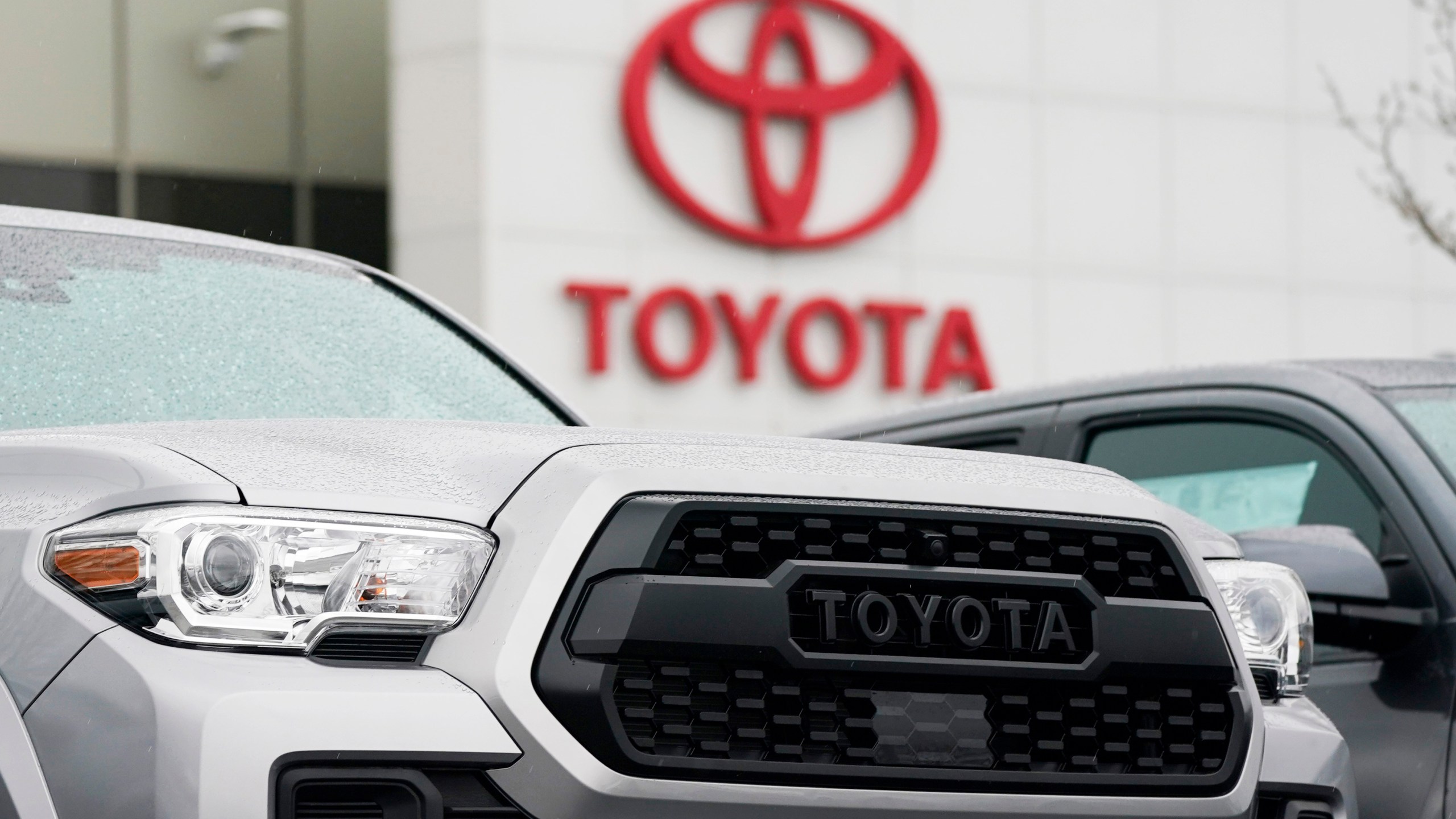 A logo of Toyota Motor Corp. is seen at its dealership in Lakewood, Colo., on March 21, 2021. Toyota says it plans to make an all solid-state battery as part of ambitious plans for battery electric vehicles, amid mounting criticism Japan’s top automaker needs to do more to fight climate change. (AP Photo/David Zalubowski)