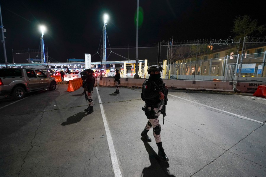 FILE - Mexican National Guards patrol among the lanes of cars entering the San Ysidro Port of Entry in Tijuana, Mexico, May 11, 2023. Montserrat Caballero, the mayor of the Mexican border city of Tijuana, said on June 12, 2023 she has decided to go live at an army base for her own safety, after she received threats. (AP Photo/Gregory Bull, File)