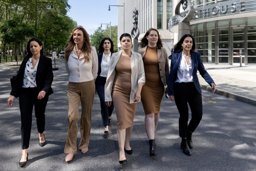 Nicole Daedone, second from left, founder and former CEO of OneTaste, second from left, departs Brooklyn federal court on Tuesday, June 13, 2023, in New York. Daedone, an entrepreneur who promoted group “orgasmic meditation” as a road to women’s well-being, turned herself in and pleaded not guilty Tuesday to a charge of manipulating traumatized people into debt, undesired sex and underpaid work. (AP Photo/Jeenah Moon)