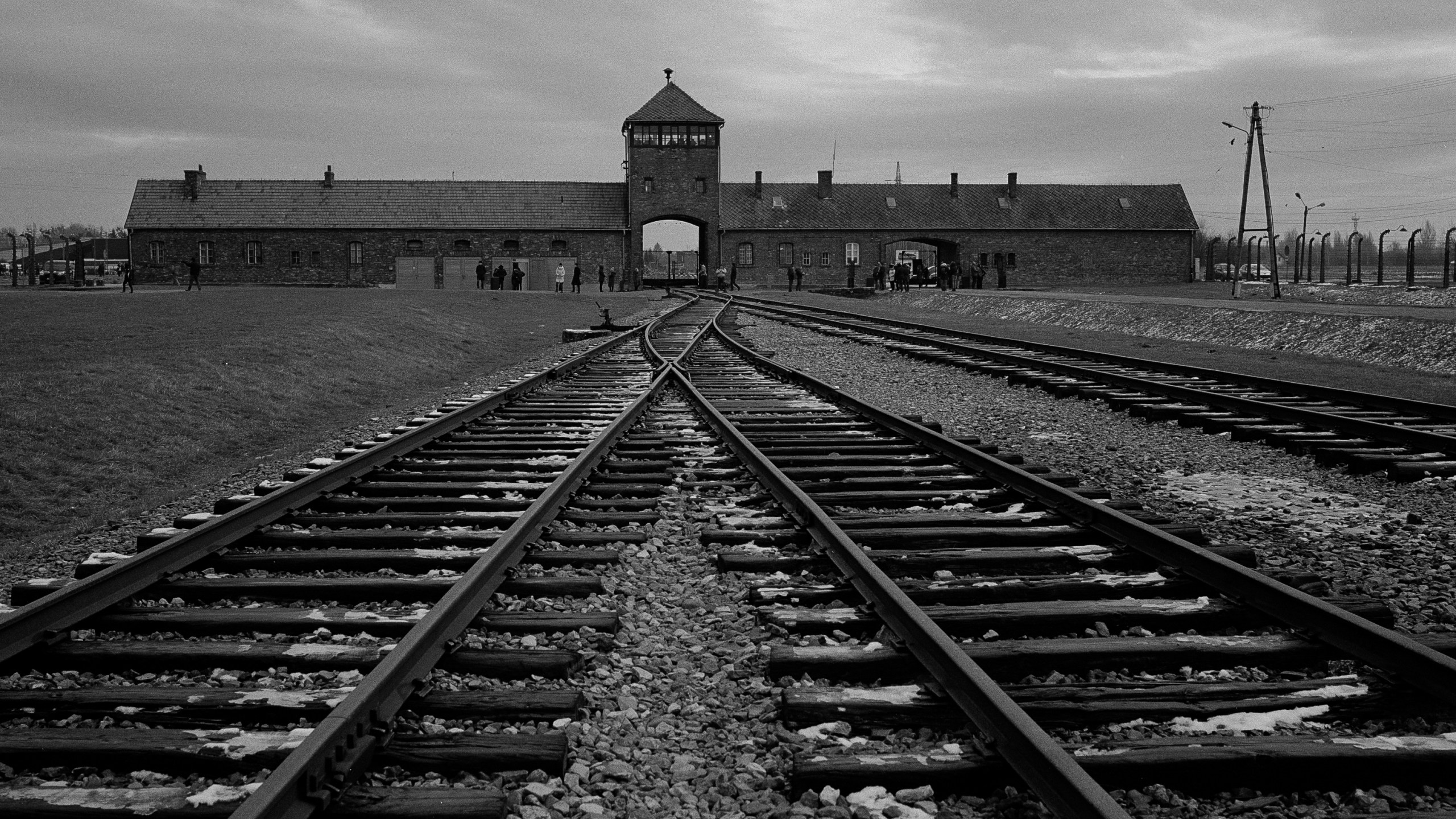 FILE - The railway tracks where hundred thousands of people arrived to be directed to the gas chambers inside the former Nazi death camp of Auschwitz Birkenau, or Auschwitz II, are pictured in Oswiecim, Poland, Saturday, Dec. 7, 2019. The organization that handles claims on behalf of Jews who suffered under the Nazis says that Germany has agreed extend compensation for Holocaust survivors around the globe for the coming year. (AP Photo/Markus Schreiber, file)