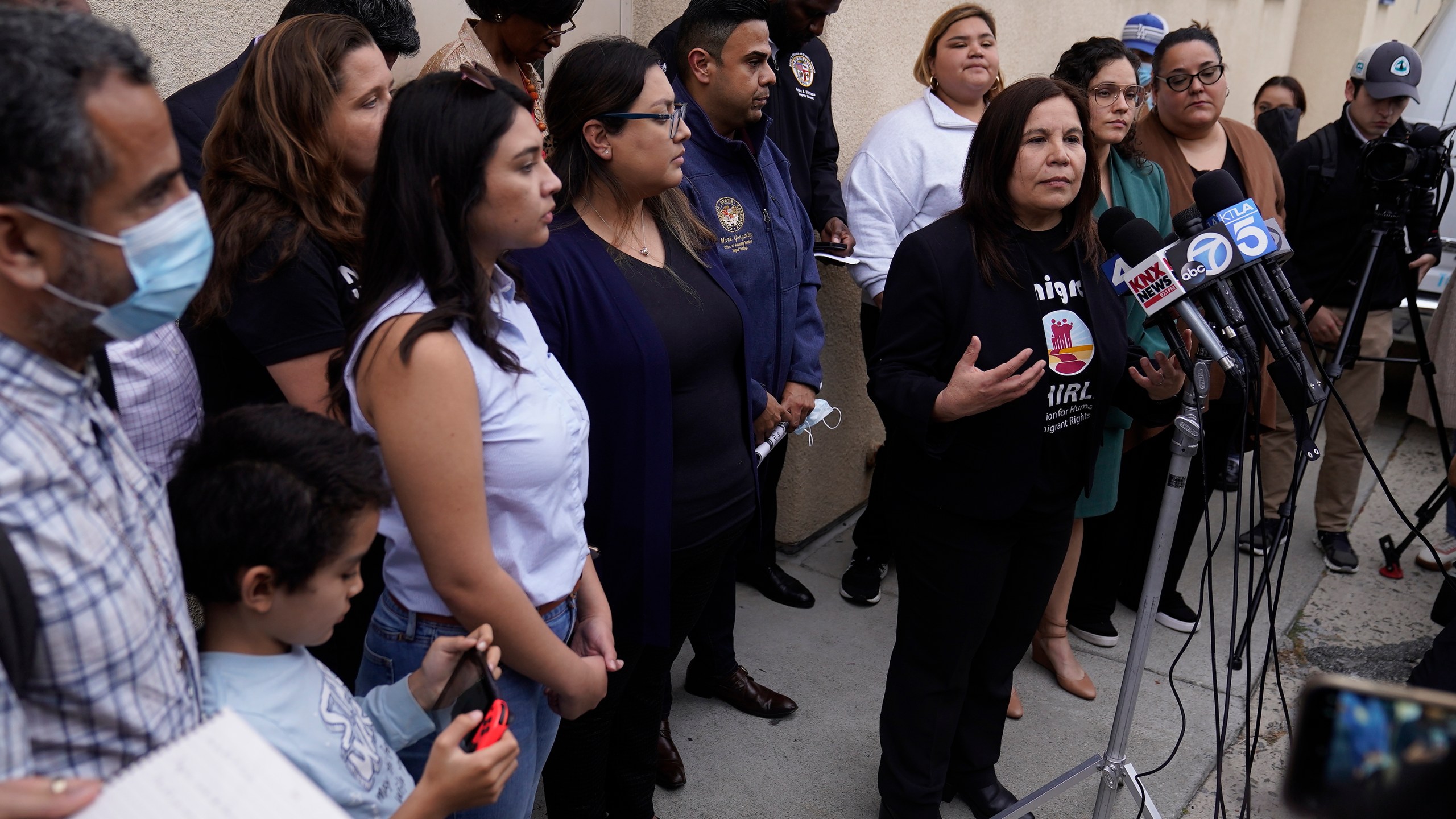 Angelica Salas, executive director of Coalition for Humane Immigrant Rights, speaks to reporters gathered outside St. Anthony's Croatian Catholic Church in Los Angeles on Wednesday, June 14, 2023. Forty-two migrants, including some children, were dropped off at Union Station around 4 p.m. Wednesday and were being cared for at the church. Texas Gov. Greg Abbott said the migrants were sent to Los Angeles because California had declared itself a "sanctuary" for immigrants. (AP Photo/Damian Dovarganes)