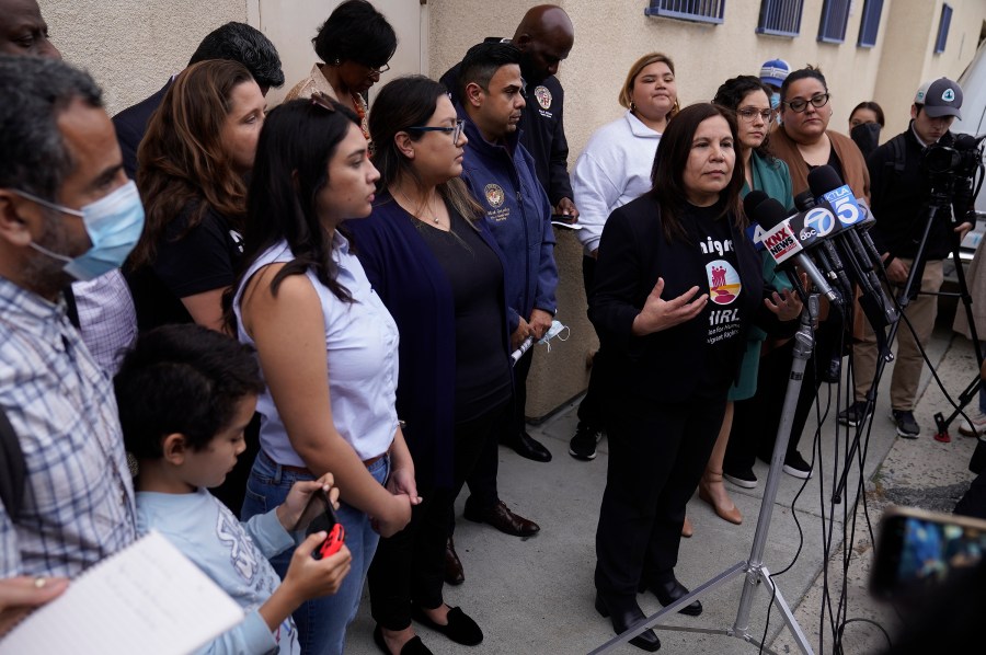 Angelica Salas, executive director of Coalition for Humane Immigrant Rights, speaks to reporters gathered outside St. Anthony's Croatian Catholic Church in Los Angeles on Wednesday, June 14, 2023. Forty-two migrants, including some children, were dropped off at Union Station around 4 p.m. Wednesday and were being cared for at the church. Texas Gov. Greg Abbott said the migrants were sent to Los Angeles because California had declared itself a "sanctuary" for immigrants. (AP Photo/Damian Dovarganes)