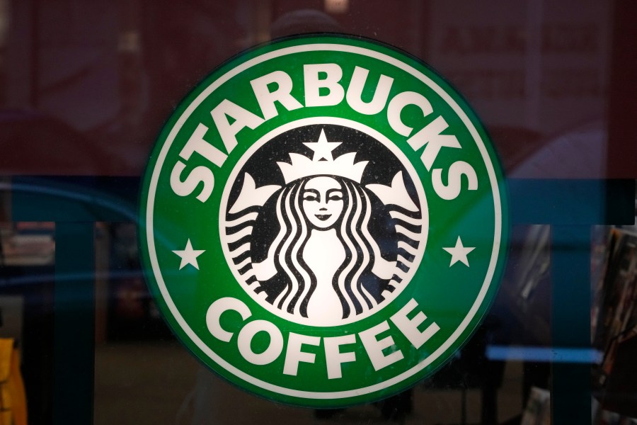 FILE - The Starbucks sign is displayed in the window of a Pittsburgh Starbucks, Jan. 30, 2023. On Monday, June 12, jurors in a federal court in New Jersey awarded $25.6 million to a former regional Starbucks manager who alleged that she and other white employees were unfairly punished by the coffee chain after the high-profile 2018 arrests of two Black men at one of the chain's Philadelphia locations. (AP Photo/Gene J. Puskar, File)