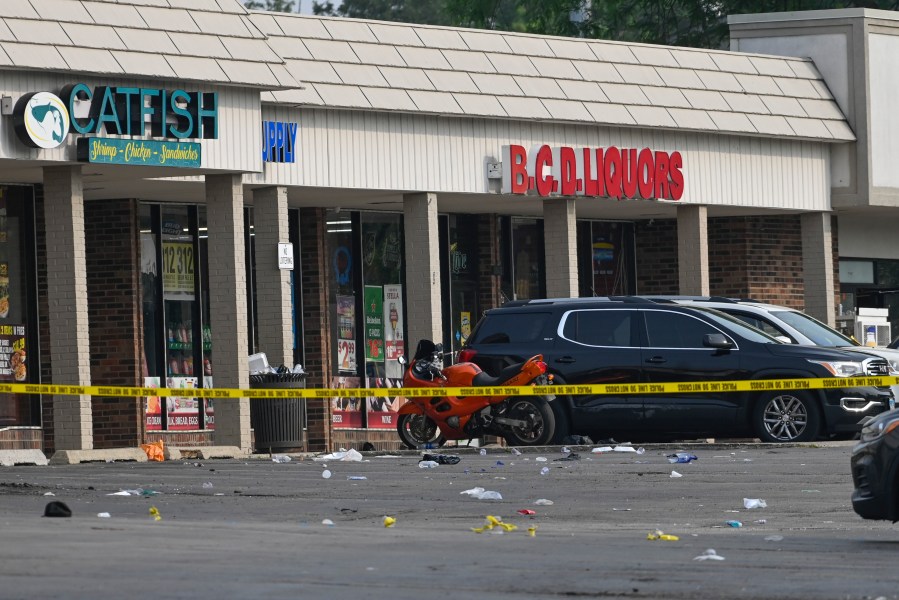 Police tape blocks an area at the scene of an overnight mass shooting at a strip mall in Willowbrook, Ill., Sunday, June 18, 2023. (AP Photo/Matt Marton)