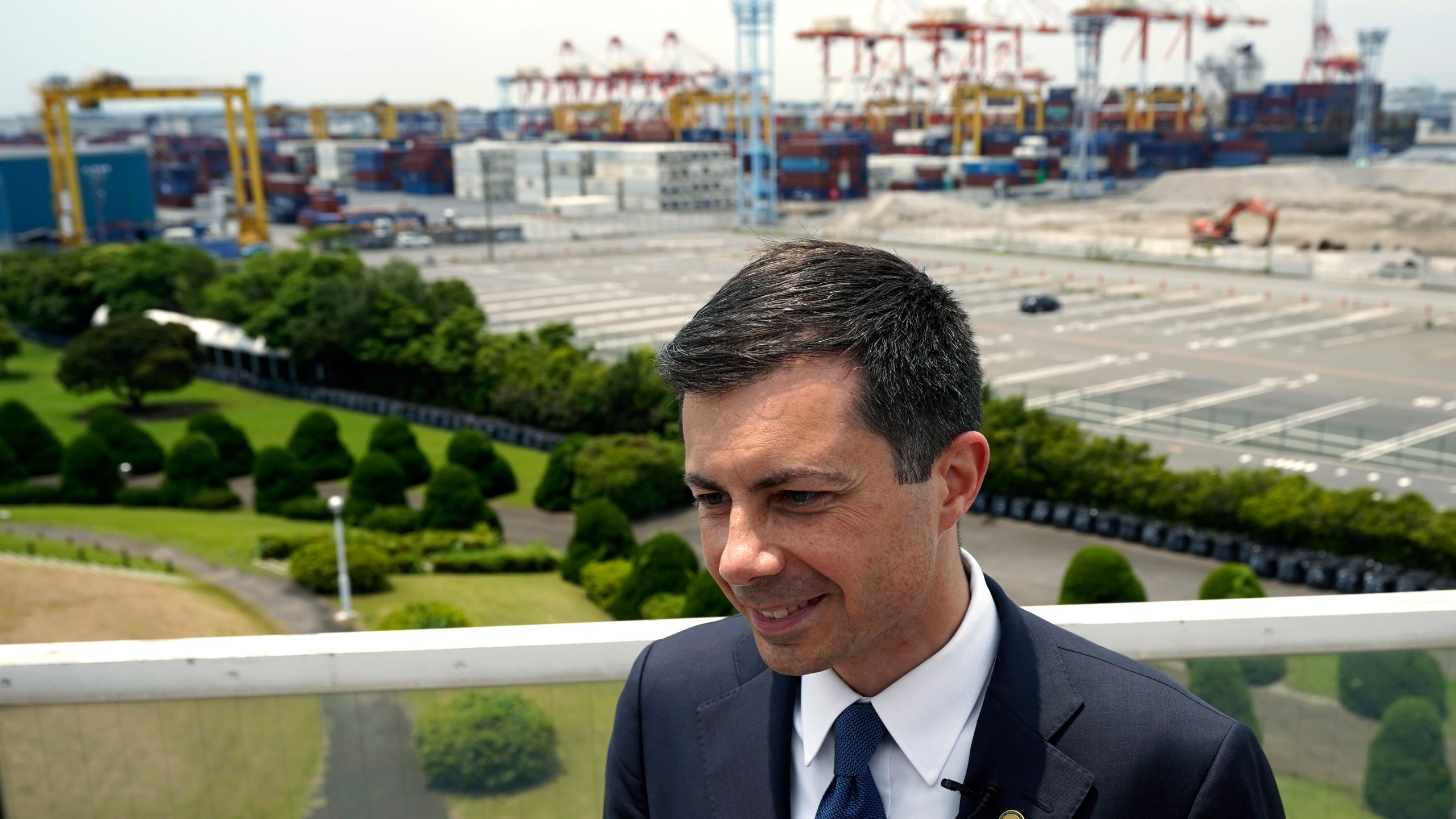 U.S. Secretary of Transportation Pete Buttigieg speaks during an interview with the Associated Press after touring Yokohama Port which includes a visit to a construction site for a new pier that will accommodate larger ships coming from the U.S. on Monday, June 19, 2023, in Tokyo. (AP Photo/Eugene Hoshiko)