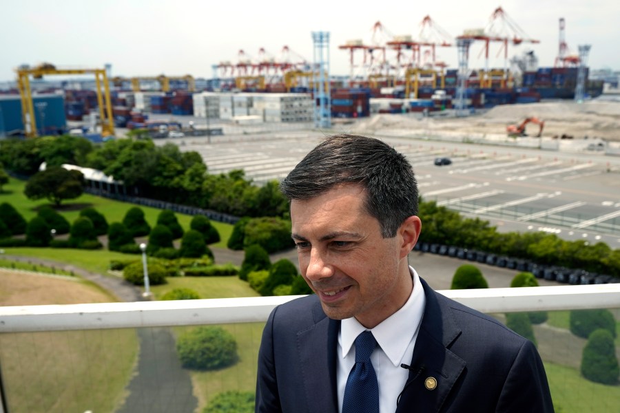 U.S. Secretary of Transportation Pete Buttigieg speaks during an interview with the Associated Press after touring Yokohama Port which includes a visit to a construction site for a new pier that will accommodate larger ships coming from the U.S. on Monday, June 19, 2023, in Tokyo. (AP Photo/Eugene Hoshiko)