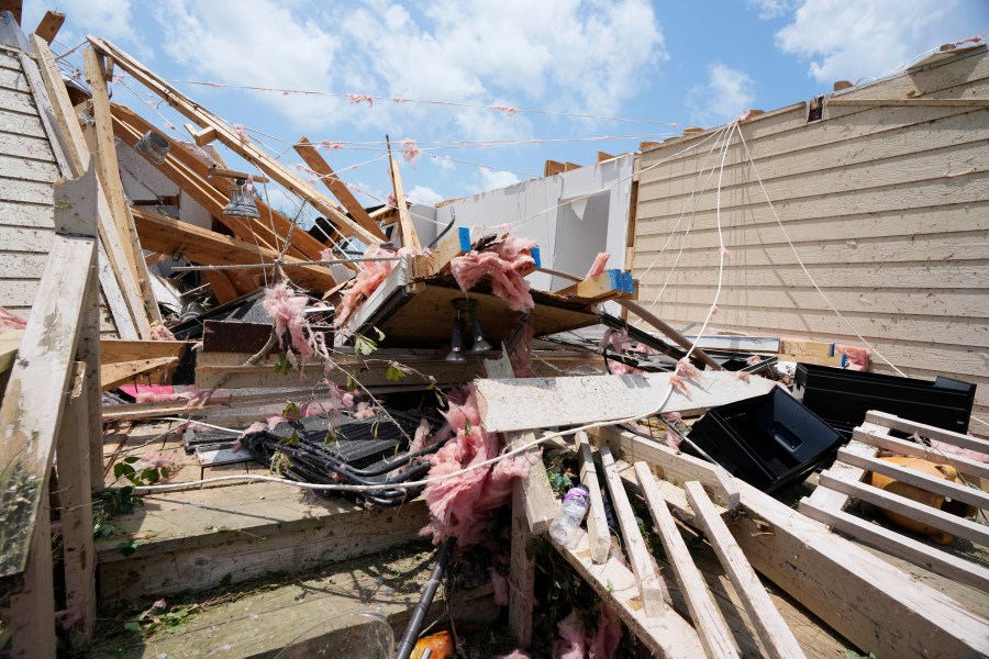 Debris litters a home following a Sunday night tornado that swept through Louin, Miss., Monday, June 19, 2023. (AP Photo/Rogelio V. Solis)