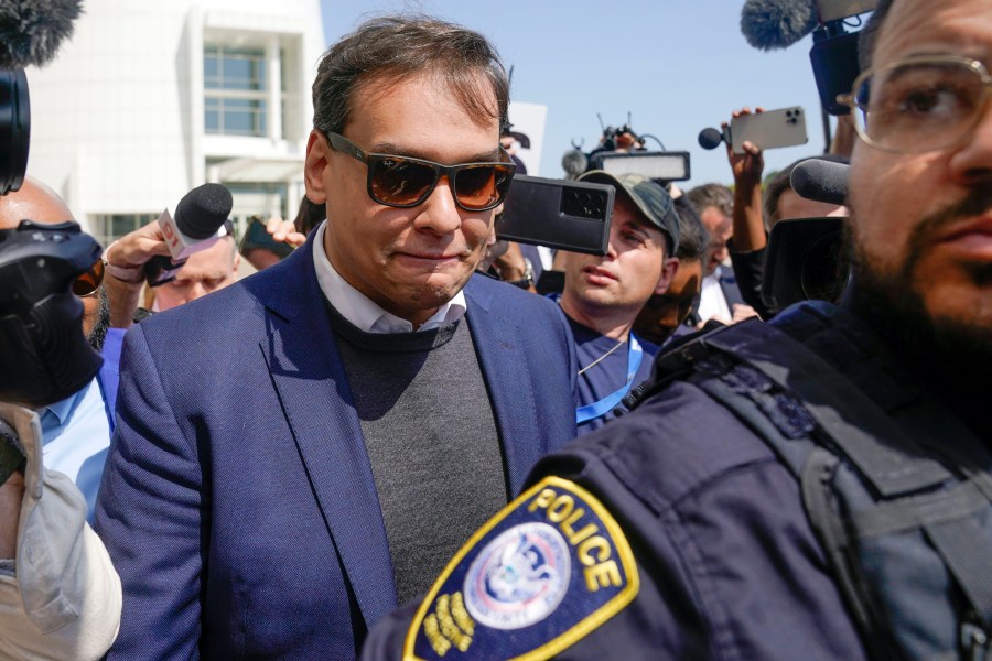 FILE — U.S. Rep. George Santos leaves the federal courthouse in Central Islip, N.Y., May 10, 2023. The two people who bailed Santos out of federal custody have been revealed to be his father and his aunt, a detail the Republican fought to keep secret as he faces criminal charges and swirling questions about his finances. Gercino dos Santos Jr. and Elma Preven were named in a court filing on Thursday, June 22, 2023, as the co-signers of Santos' $500,000 bond. (AP Photo/Seth Wenig. File)