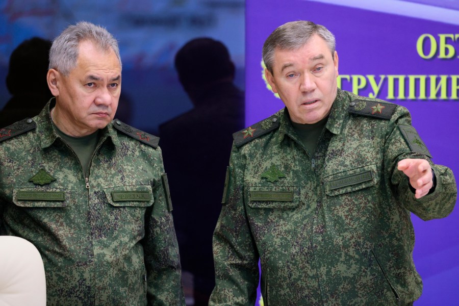 FILE - Russian Defense Minister Sergei Shoigu, left, and Chief of the Russian General Staff Valery Gerasimov attend the meeting with Russian President Vladimir Putin during his visit to the joint staff of troops involved in Russia's military operation in Ukraine, at an unknown location, Saturday, Dec. 17, 2022. Russian military leaders have remained silent as they faced angry rants from Yevgeny Prigozhin, the maverick millionaire head of the private military contractor Wagner. (Gavriil Grigorov, Sputnik, Kremlin Pool Photo via AP, File)