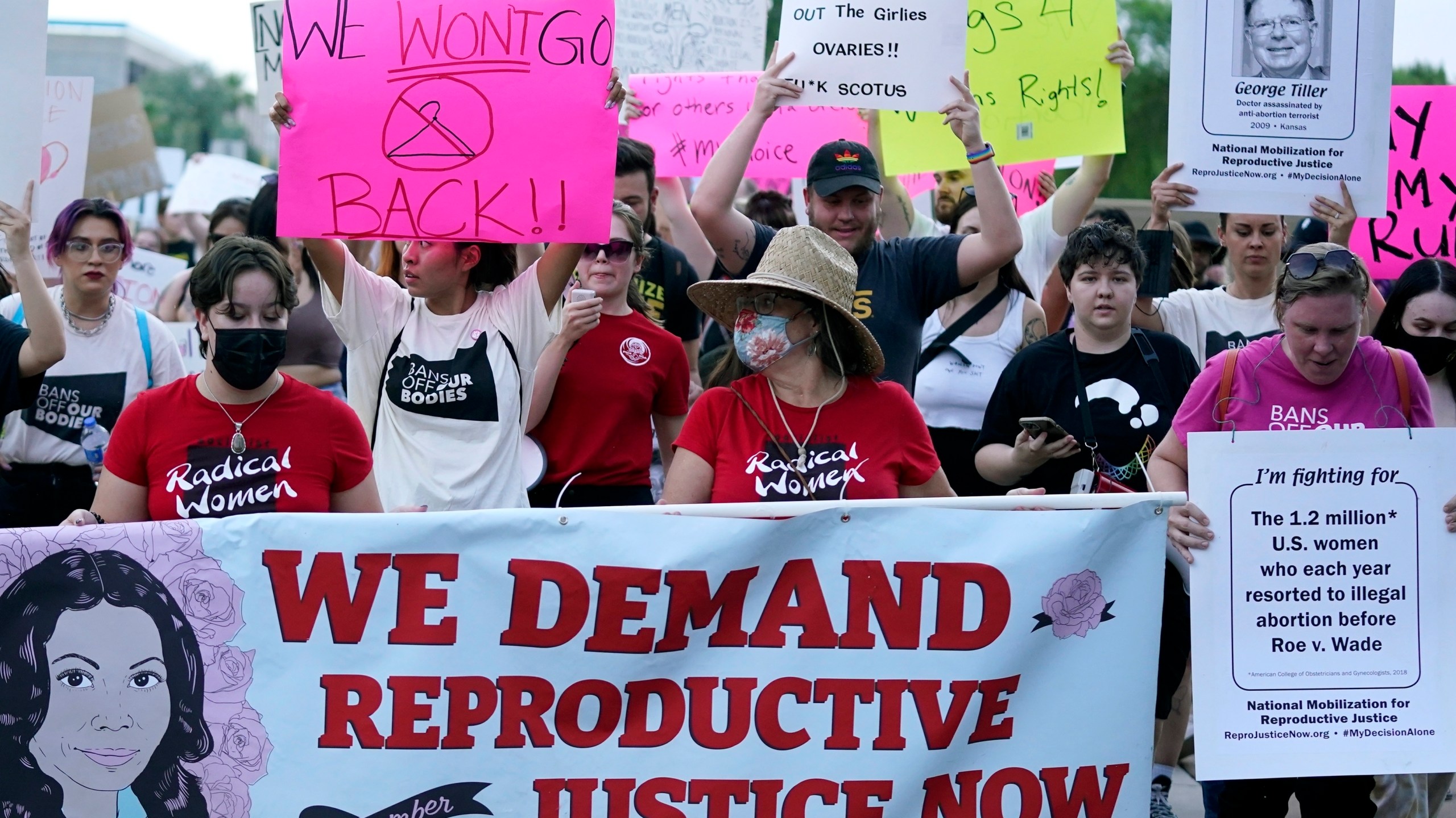 FILE - Thousands of protesters march around the Arizona Capitol after the Supreme Court decision to overturn the landmark Roe v. Wade abortion decision Friday, June 24, 2022, in Phoenix. Gov. Katie Hobbs on Friday, June 23, 2023 signed a sweeping executive order to protect anyone involved with a legally obtained abortion from prosecution. (AP Photo/Ross D. Franklin, File)