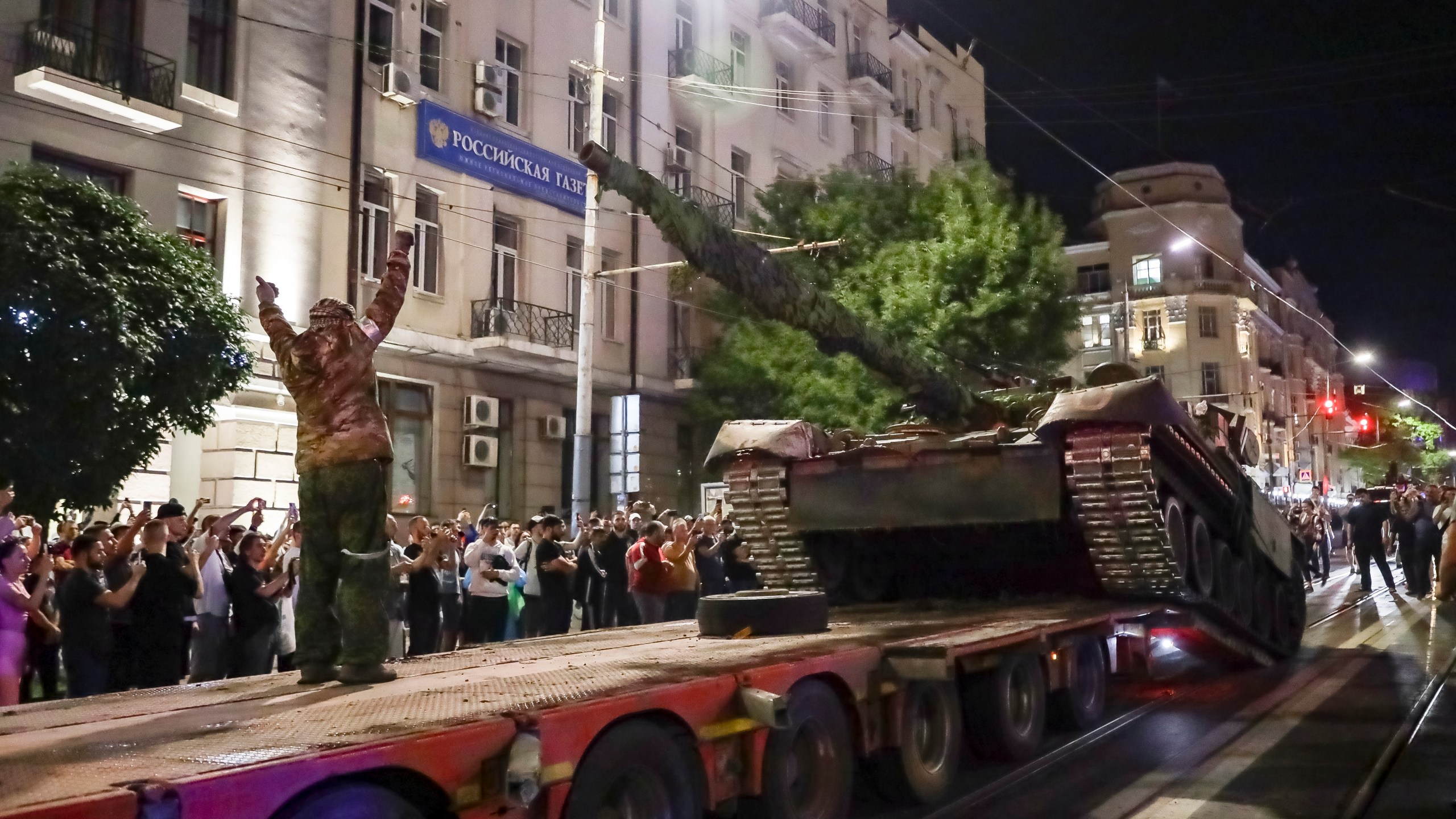 Members of the Wagner Group military company load their tank onto a truck on a street in Rostov-on-Don, Russia, Saturday, June 24, 2023, prior to leaving an area at the headquarters of the Southern Military District. Kremlin spokesman Dmitry Peskov said that Yevgeny Prigozhin's troops who joined him in the uprising will not face prosecution and those who did not will be offered contracts by the Defense Ministry. After the deal was reached Saturday, Prigozhin ordered his troops to halt their march on Moscow and retreat to field camps in Ukraine, where they have been fighting alongside Russian troops. (AP Photo)