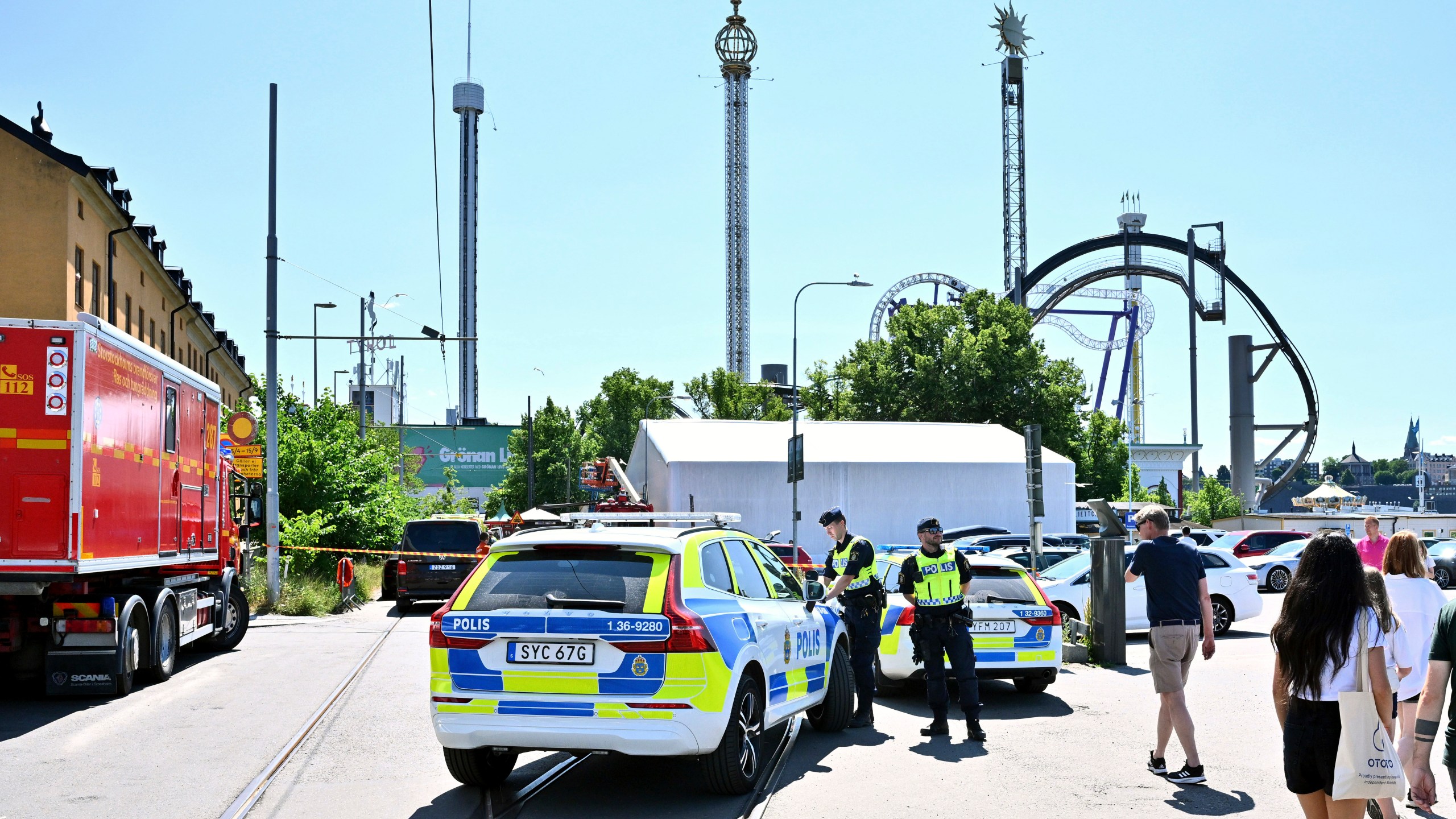 Police cordon off the Gröna Lund amusement park in Stockholm, Sunday, June 25, 2023. According to reports an accident occurred on a rollercoaster leaving one person dead. The amusement park was being evacuated and the police have set up cordons. (Claudio Bresciani/TT News Agency via AP)