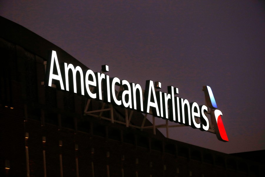 FILE - The American Airlines logo on top of the American Airlines Center in Dallas, Texas, Dec. 19, 2017. Personal information for more than 8,000 applicants to become pilots at American Airlines and Southwest Airlines was stolen when hackers broke into a data base maintained by a recruiting company. The breach at Austin, Texas-based Pilot Credentials occurred on April 30, and the airlines learned about it on May 3. (AP Photo/Michael Ainsworth, File)