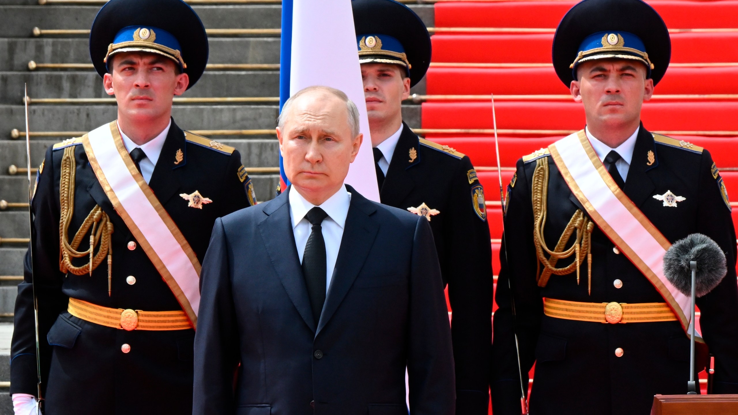 Russian President Vladimir Putin listens to the national anthem prior to delivering a speech to the units of the Russian Defense Ministry, the Russian National Guard (Rosgvardiya), the Russian Interior Ministry, the Russian Federal Security Service and the Russian Federal Guard Service, who ensured order and legality during the mutiny, at the Kremlin in Moscow, Russia, Tuesday, June 27, 2023. (Sergei Guneyev, Sputnik, Kremlin Pool Photo via AP)