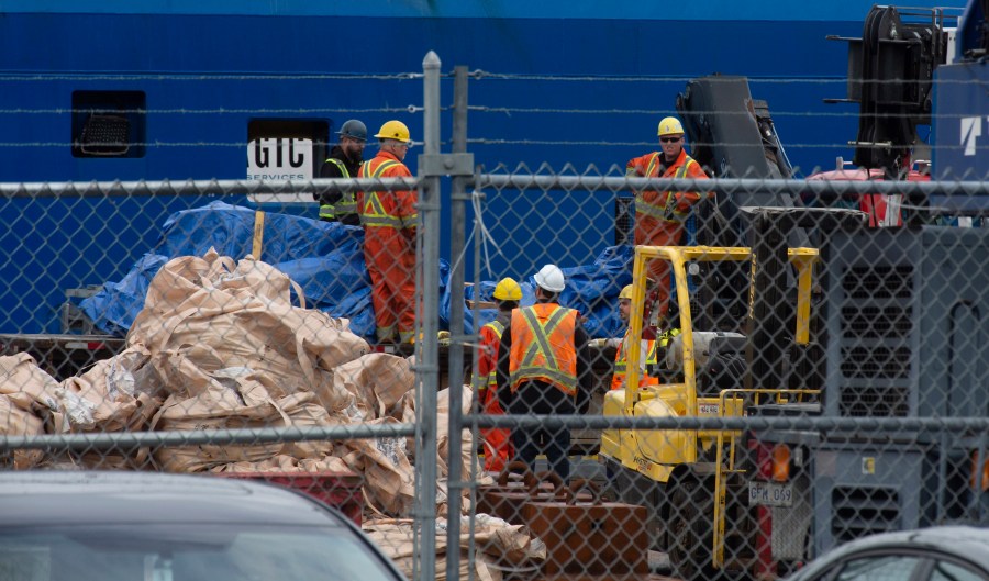 Debris from the Titan submersible, recovered from the ocean floor near the wreck of the Titanic, is unloaded from the ship Horizon Arctic at the Canadian Coast Guard pier in St. John's, Newfoundland on Wednesday, June 28, 2023. (Paul Daly/The Canadian Press via AP)