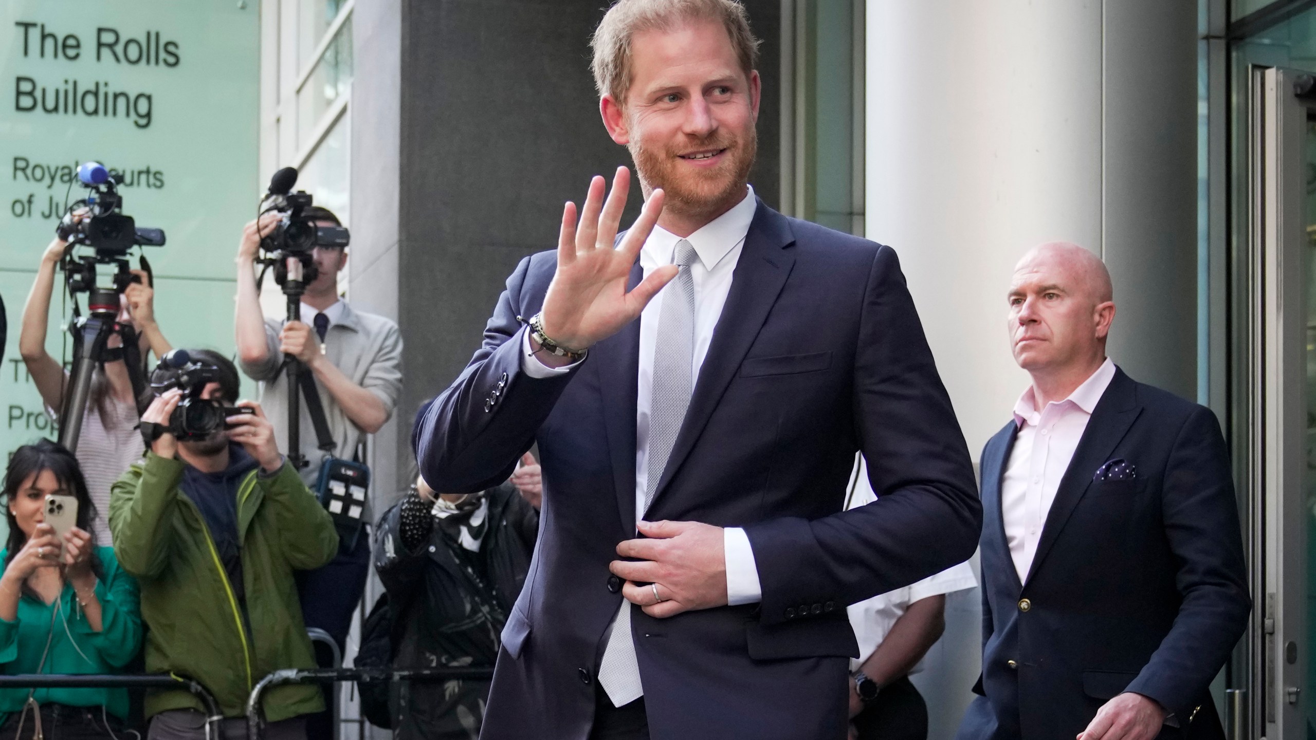 FILE - Prince Harry leaves the High Court after giving evidence in London, Wednesday, June 7, 2023. Prince Harry is seeking 320,000 pounds ($406,000) in his phone hacking lawsuit against Mirror Group Newspapers. The Duke of Sussex's lawyer submitted the claim in a court document Friday, June 30, 2023, at the conclusion of the trial that began in early May. (AP Photo/Kin Cheung, File)