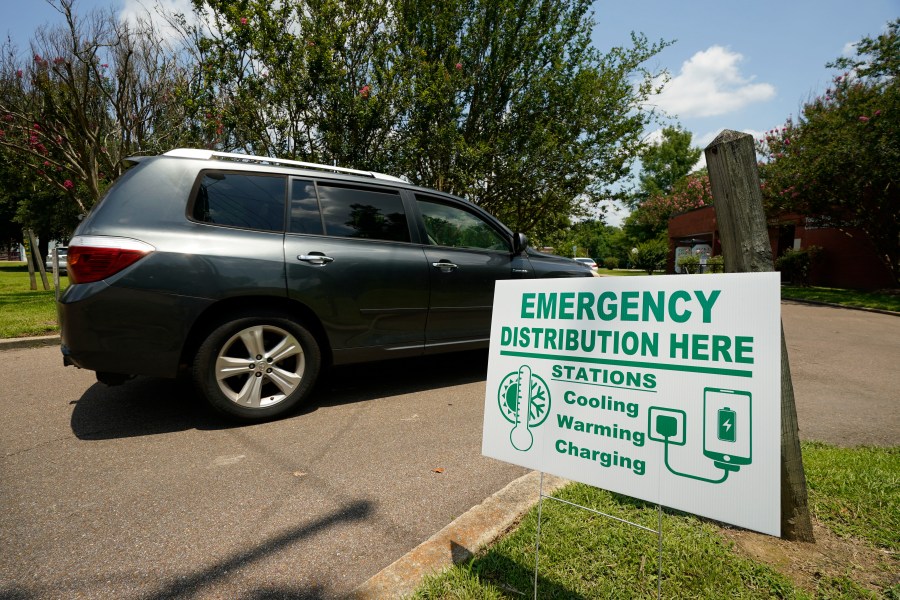 A Jackson, Miss., resident drives to the Tougaloo Community Center, Thursday, June 29, 2023, where the City of Jackson located one of six cooling centers. An oppressive heat wave blamed for at least 13 deaths in Texas and one in Louisiana is blanketing the South and the National Weather Service issued an excessive heat warning for parts of the Deep South on Friday, with a heat index expected to reach 115 degrees in several cities. (AP Photo/Rogelio V. Solis)