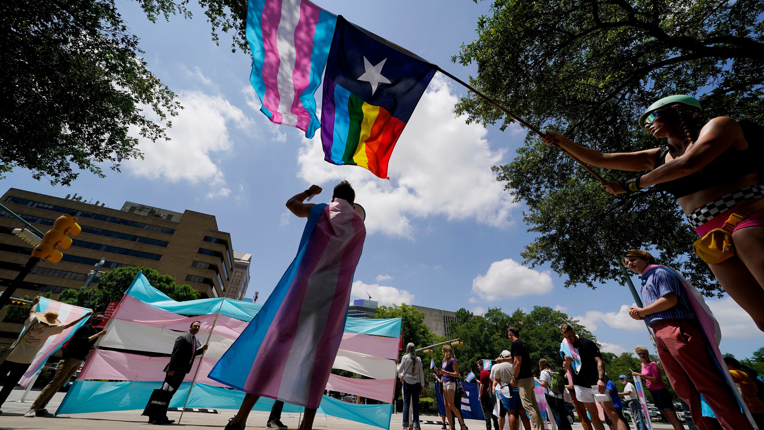 FILE - Demonstrators gather on the steps to the State Capitol to speak against transgender-related legislation bills being considered in the Texas Senate and House, May 20, 2021, in Austin, Texas. The U.S. Supreme Court on Friday, June 30, 2023, said it will not review a first-of-its-kind ruling from a federal appeals court that found people with gender dysphoria are entitled to the protections of the Americans With Disabilities Act. (AP Photo/Eric Gay, File)