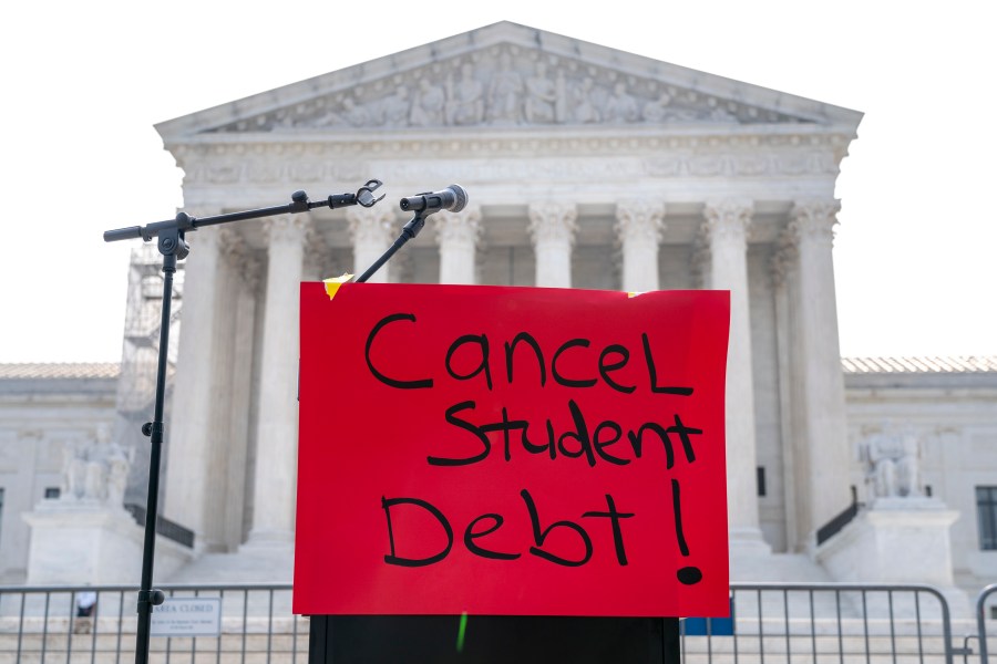 A sign reading "cancel student debt" is seen outside the Supreme Court, Friday, June 30, 2023, as decisions are expected in Washington. (AP Photo/Jacquelyn Martin)