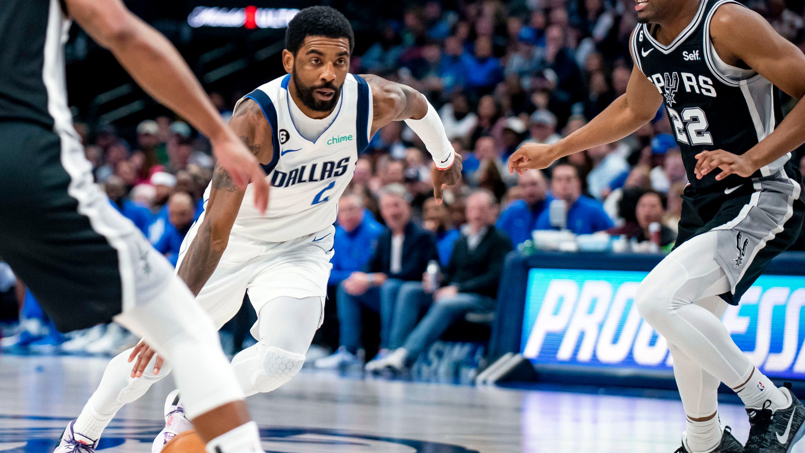 FILE - Dallas Mavericks guard Kyrie Irving (2) drives past San Antonio Spurs guard Malaki Branham (22) in the second half of an NBA basketball game Feb. 23, 2023, in Dallas. Irving agreed to stay with the Mavericks on a three-year, $126 million deal when free agency opened Friday, June 30, 2023. (AP Photo/Emil T. Lippe, File)