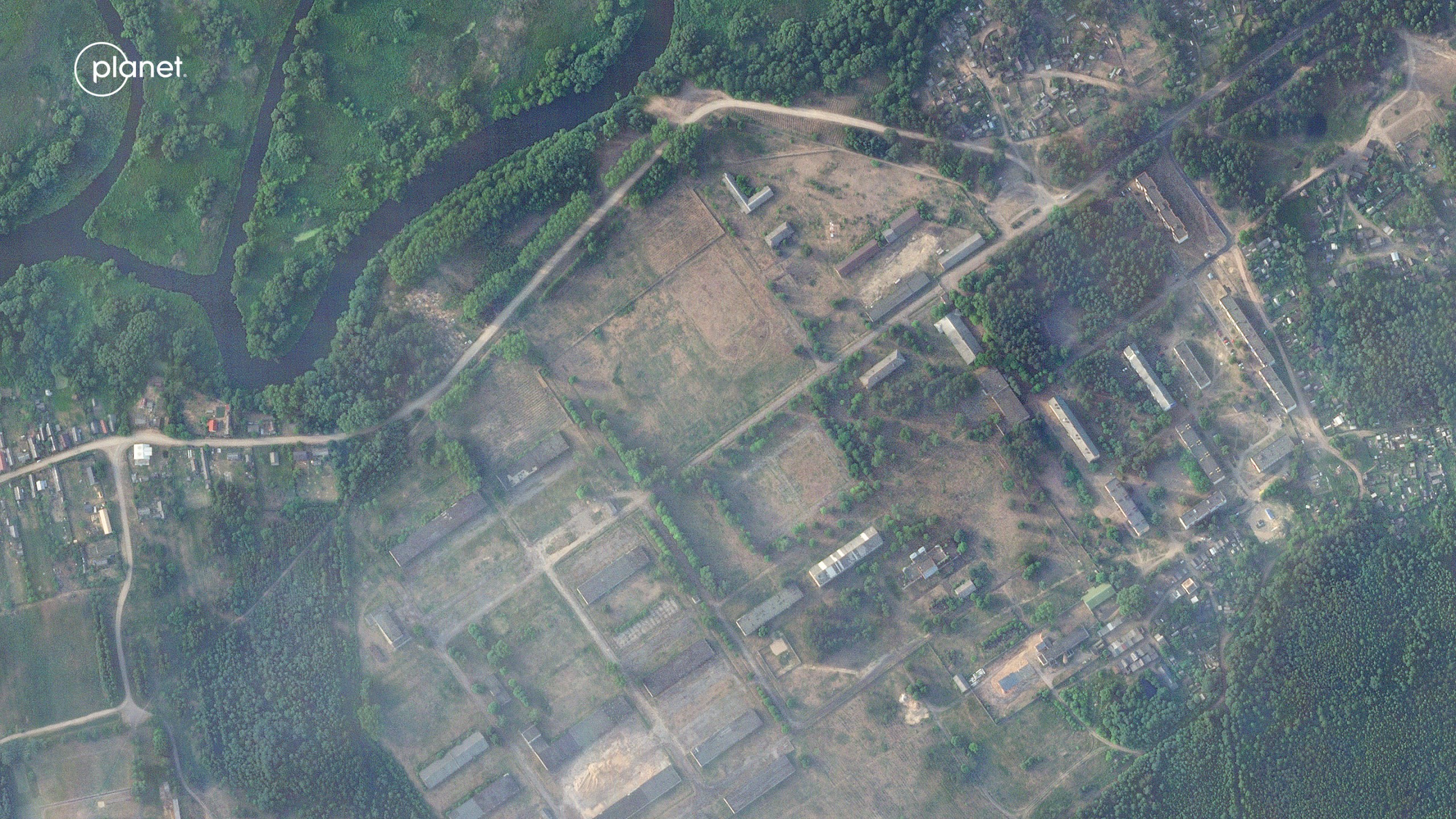 This satellite image provided by Planet Labs PBC taken on Thursday, June 15, 2023, shows a former military base outside the Belarusian town of Osipovichi shows no signs of the structures that appeared two weeks later. As part of a deal to end a rebellion in Russia by Wagner Group mercenaries, Belarus’s president says he offered the fighters an abandoned military unit to set up camp and the leader of an exiled Belarusian guerrilla organization told The AP it is near Osipovichi. (Planet Labs PBC via AP)