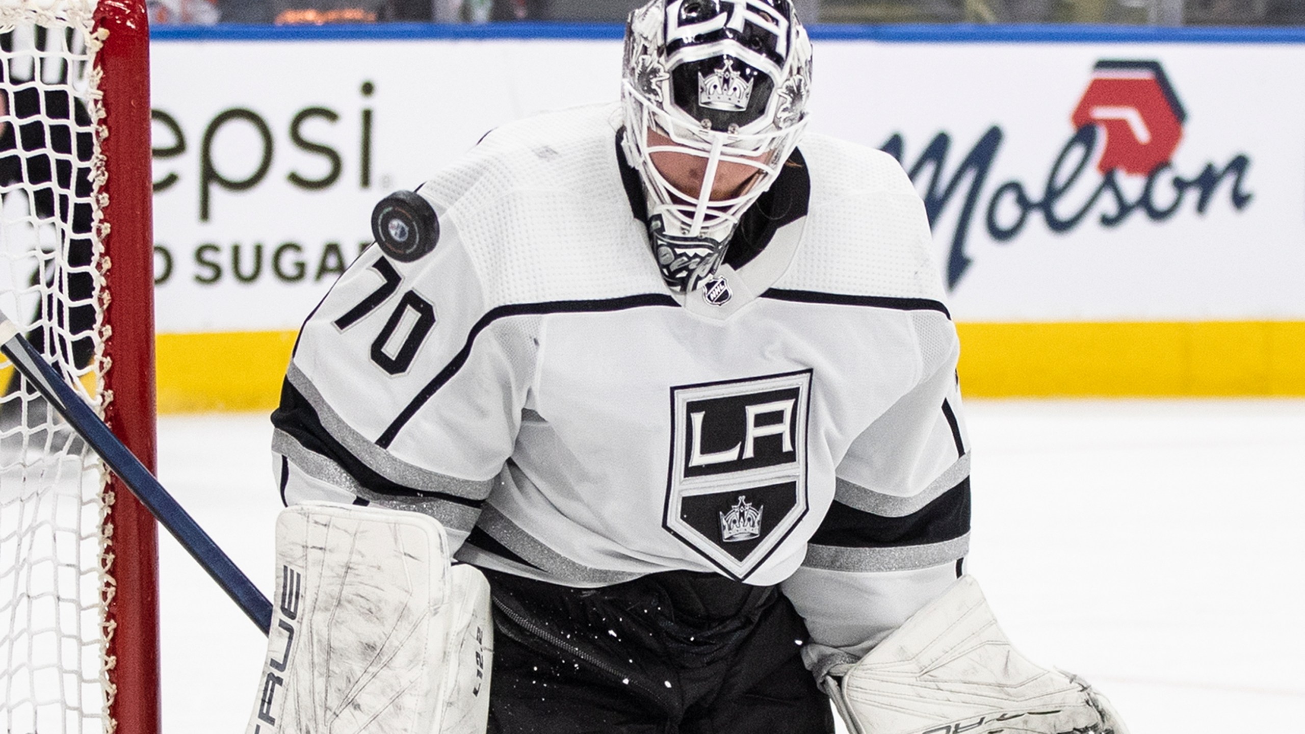 FILE - Los Angeles Kings goalie Joonas Korpisalo (70) makes a save against the Edmonton Oilers during the second period of Game 1 of an NHL Stanley Cup first-round hockey playoff series in Edmonton, Alberta, April 17, 2023. On Saturday, July 1, the Ottawa Senators signed Korpisalo to a five-year contract worth $20 million. (Jason Franson/The Canadian Press via AP, File)