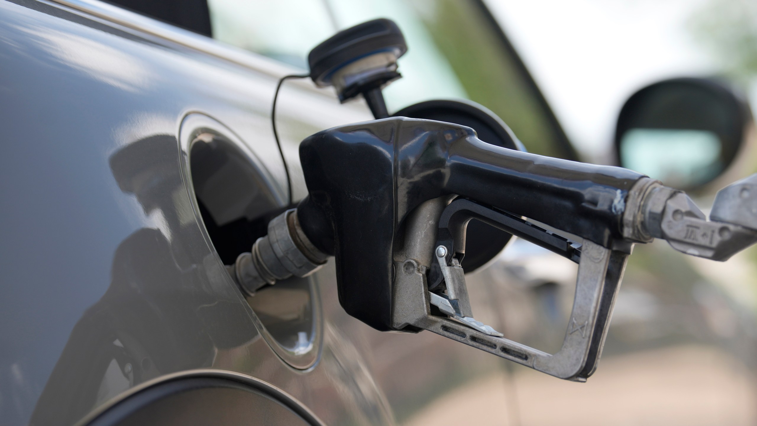 FILE - A motorist fills up a vehicle at a Shell gasoline station Sunday, June 18, 2023, in Englewood, Colo. High prices have left U.S. adults deeply pessimistic about the economy, with just 34% approving of Biden's leadership on the issue, according to a new poll from The Associated Press-NORC Center for Public Affairs. Based on follow-up interviews with poll respondents, they're far more aware of gasoline and grocery store prices than the details of President Joe Biden's policies. (AP Photo/David Zalubowski, File)