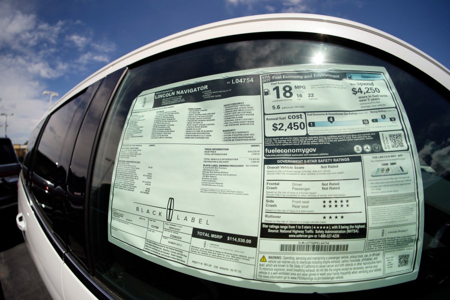 The sticker price is displayed in the window of an unsold 2023 Navigator sports-utility vehicle at a Lincoln dealership Sunday, June 18, 2023, in Englewood, Colo. U.S. automobile sales continued to recover from the global chip shortage in the first half of the year as increased production drove up supplies on dealer lots and buyers responded. (AP Photo/David Zalubowski)