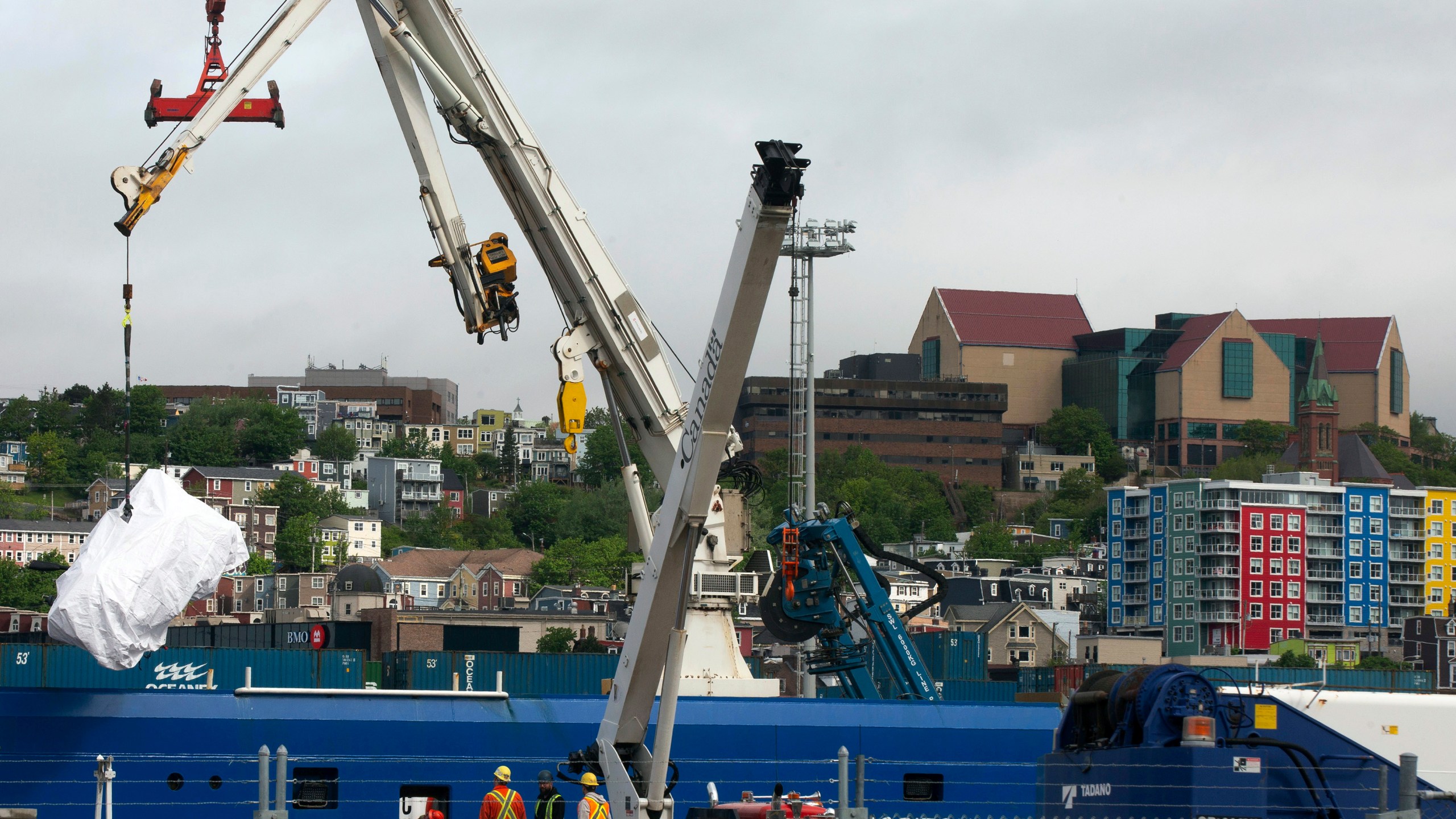 FILE - Debris from the Titan submersible, recovered from the ocean floor near the wreck of the Titanic, is unloaded from the ship Horizon Arctic at the Canadian Coast Guard pier in St. John's, Newfoundland, Wednesday, June 28, 2023. OceanGate, the company that owned a submersible that imploded on its way to explore the wreck of the Titanic, killing all five onboard, said Thursday, July 6, that it has suspended operations. (Paul Daly/The Canadian Press via AP, File)