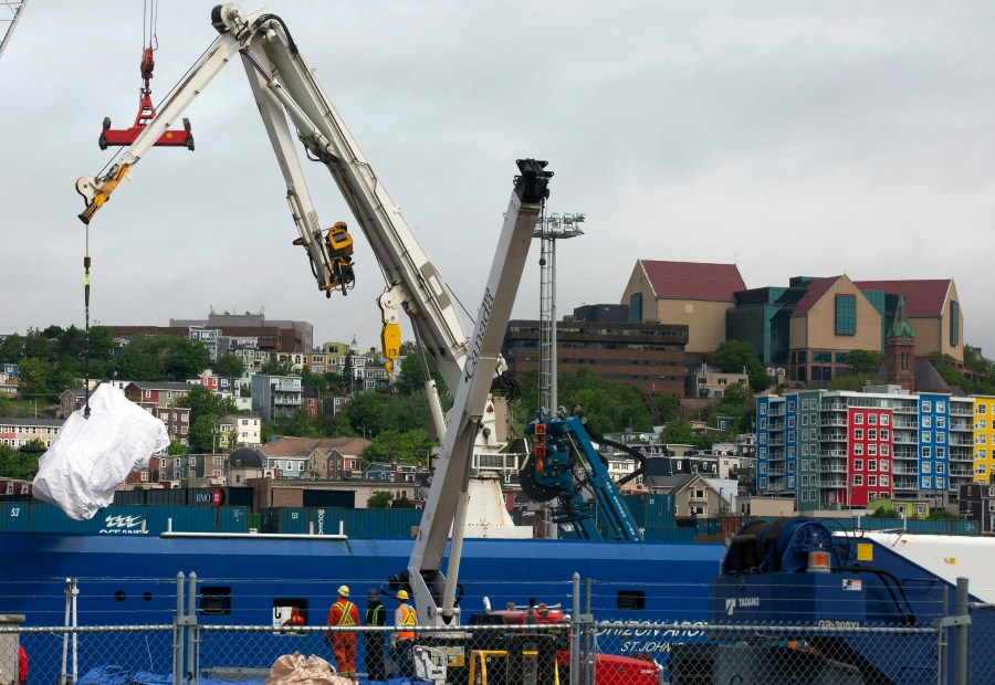 FILE - Debris from the Titan submersible, recovered from the ocean floor near the wreck of the Titanic, is unloaded from the ship Horizon Arctic at the Canadian Coast Guard pier in St. John's, Newfoundland, Wednesday, June 28, 2023. OceanGate, the company that owned a submersible that imploded on its way to explore the wreck of the Titanic, killing all five onboard, said Thursday, July 6, that it has suspended operations. (Paul Daly/The Canadian Press via AP, File)