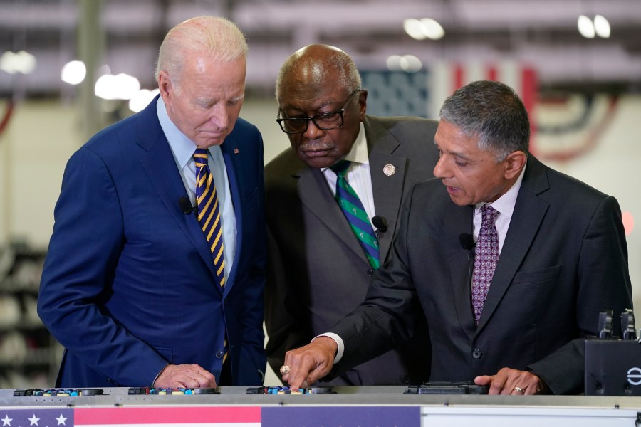 President Joe Biden and Rep. Jim Clyburn, D-S.C., listen during a tour at Flex LTD, Thursday, July 6, 2023, in West Columbia, S.C. (AP Photo/Evan Vucci)