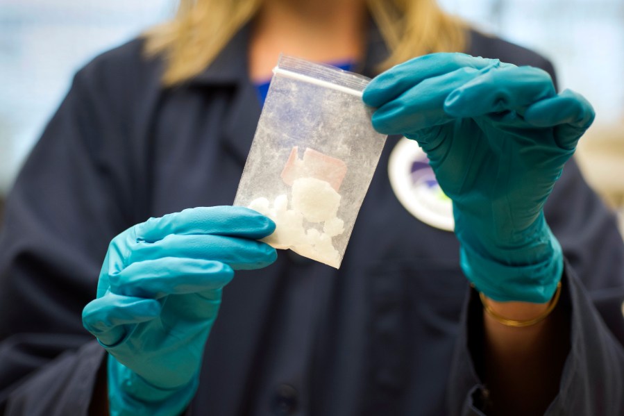 FILE - A bag of 4-fluoro isobutyryl fentanyl which was seized in a drug raid is displayed at the Drug Enforcement Administration (DEA) Special Testing and Research Laboratory in Sterling, Va., on Aug. 9, 2016. China on Friday, July 7, 2023, insisted it is up to the U.S. to “create necessary conditions” for anti-drugs cooperation, following complaints from Washington that Beijing has ignored its calls for a crackdown on precursor chemicals for the highly addictive painkiller fentanyl. (AP Photo/Cliff Owen, File)