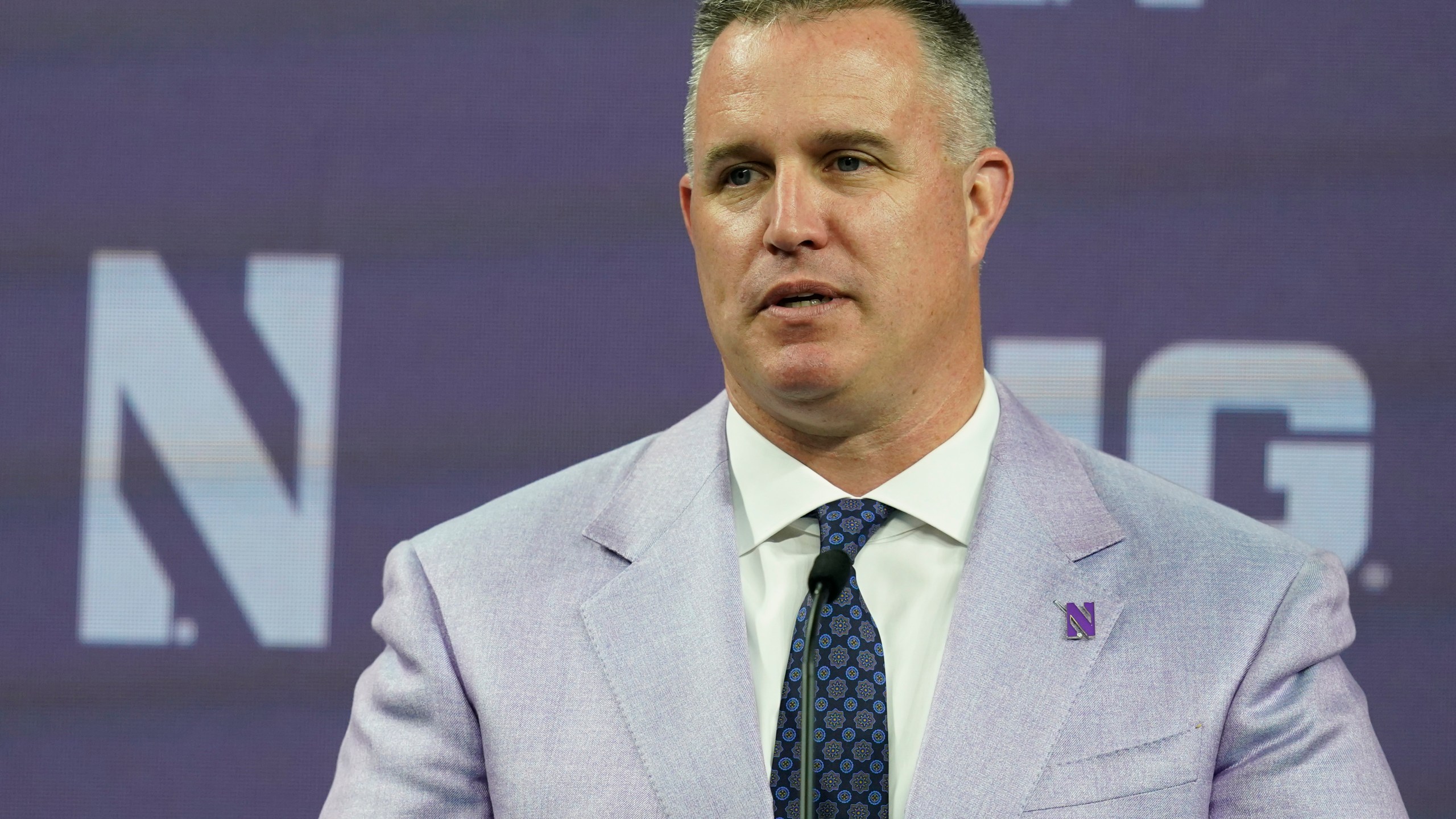 FILE - Northwestern head coach Pat Fitzgerald talks to reporters during an NCAA college football news conference at the Big Ten Conference media days, at Lucas Oil Stadium, Tuesday, July 26, 2022, in Indianapolis. Northwestern has suspended coach Pat Fitzgerald for two weeks without pay following an investigation into alleged hazing within the football program. Fitzgerald started serving his suspension on Friday, July 7, 2023. (AP Photo/Darron Cummings, File)