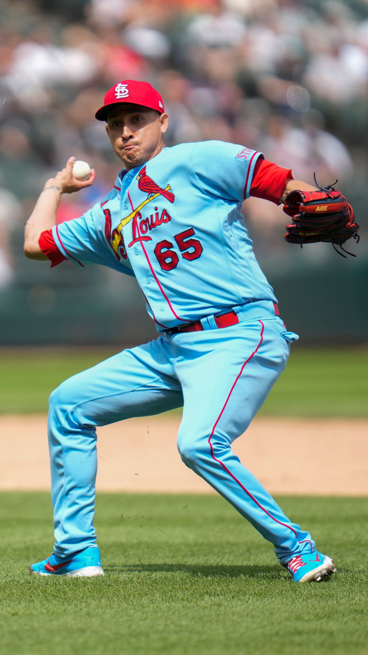 St. Louis Cardinals relief pitcher Giovanny Gallegos throws to first during the eighth inning of a baseball game against the Chicago White Sox Saturday, July 8, 2023, in Chicago. (AP Photo/Erin Hooley)