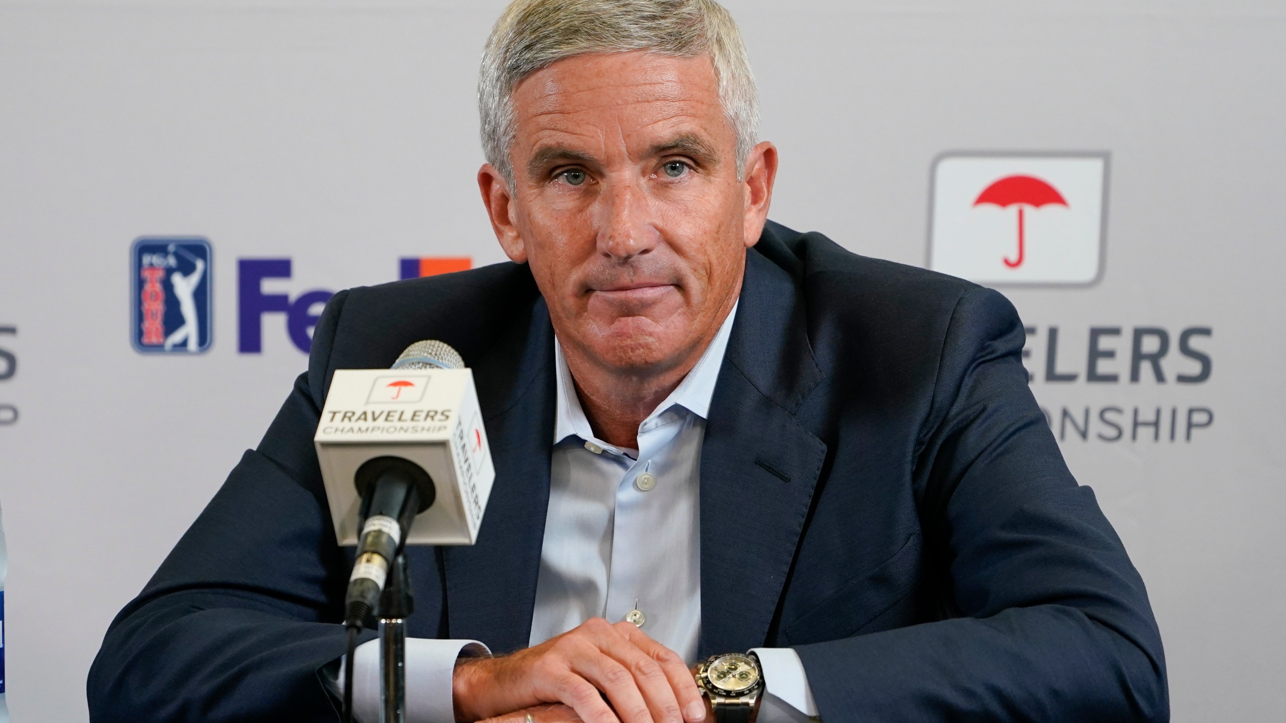 FILE - PGA Tour Commissioner Jay Monahan speaks during a news conference before the Travelers Championship golf tournament at TPC River Highlands, June 22, 2022, in Cromwell, Conn. Monahan is returning to work just over a month after he stepped away for a “medical situation” during a tumultuous time of working out a surprise commercial agreement with the Saudi backers of LIV Golf. (AP Photo/Seth Wenig, File)