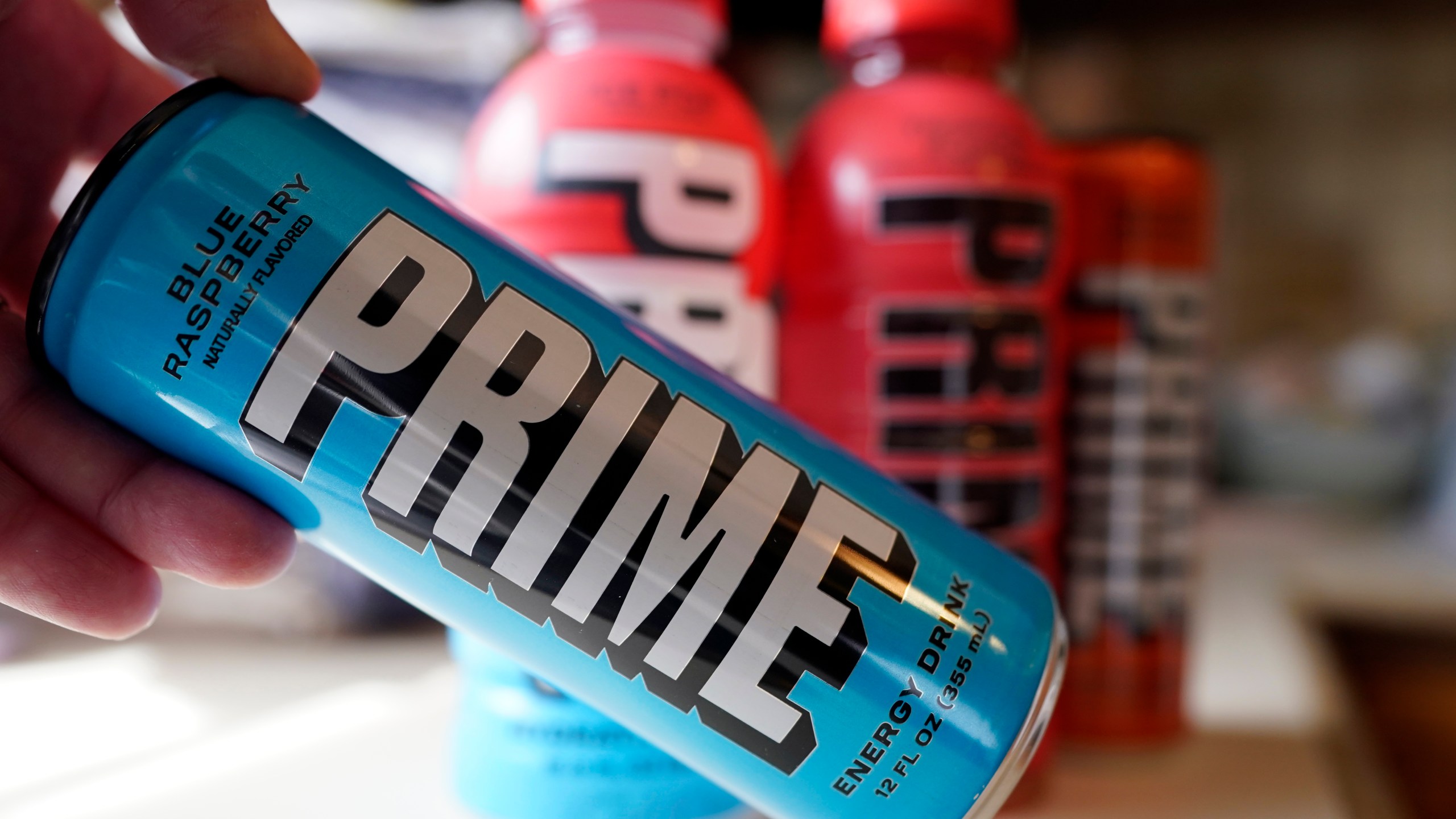 A Prime Energy drink is seen, Friday, March 24, 2023, in Detroit. The influencer-backed energy drink that has earned viral popularity among children is facing scrutiny from lawmakers and health experts over its potentially dangerous levels of caffeine. (AP Photo/Carlos Osorio)