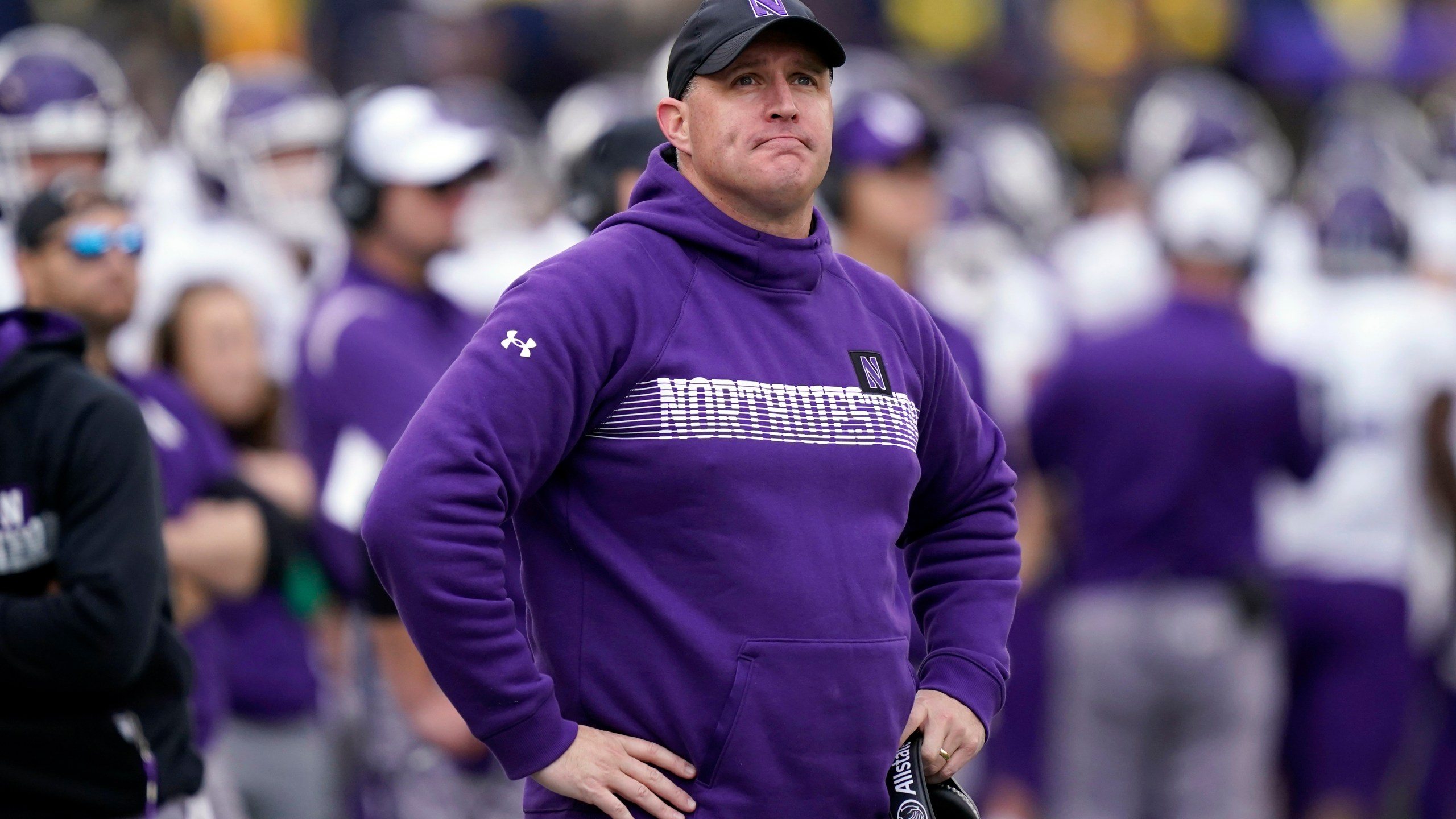 FILE - Northwestern head coach Pat Fitzgerald stands on the sideline during the first half of an NCAA college football game against Michigan, Oct. 23, 2021, in Ann Arbor, Mich. Northwestern has fired Fitzgerald Monday, July 10, 2023, amid a hazing scandal that called into question his leadership of the program and damaged the university's reputation after it mishandled its response to the allegations. (AP Photo/Carlos Osorio, File)