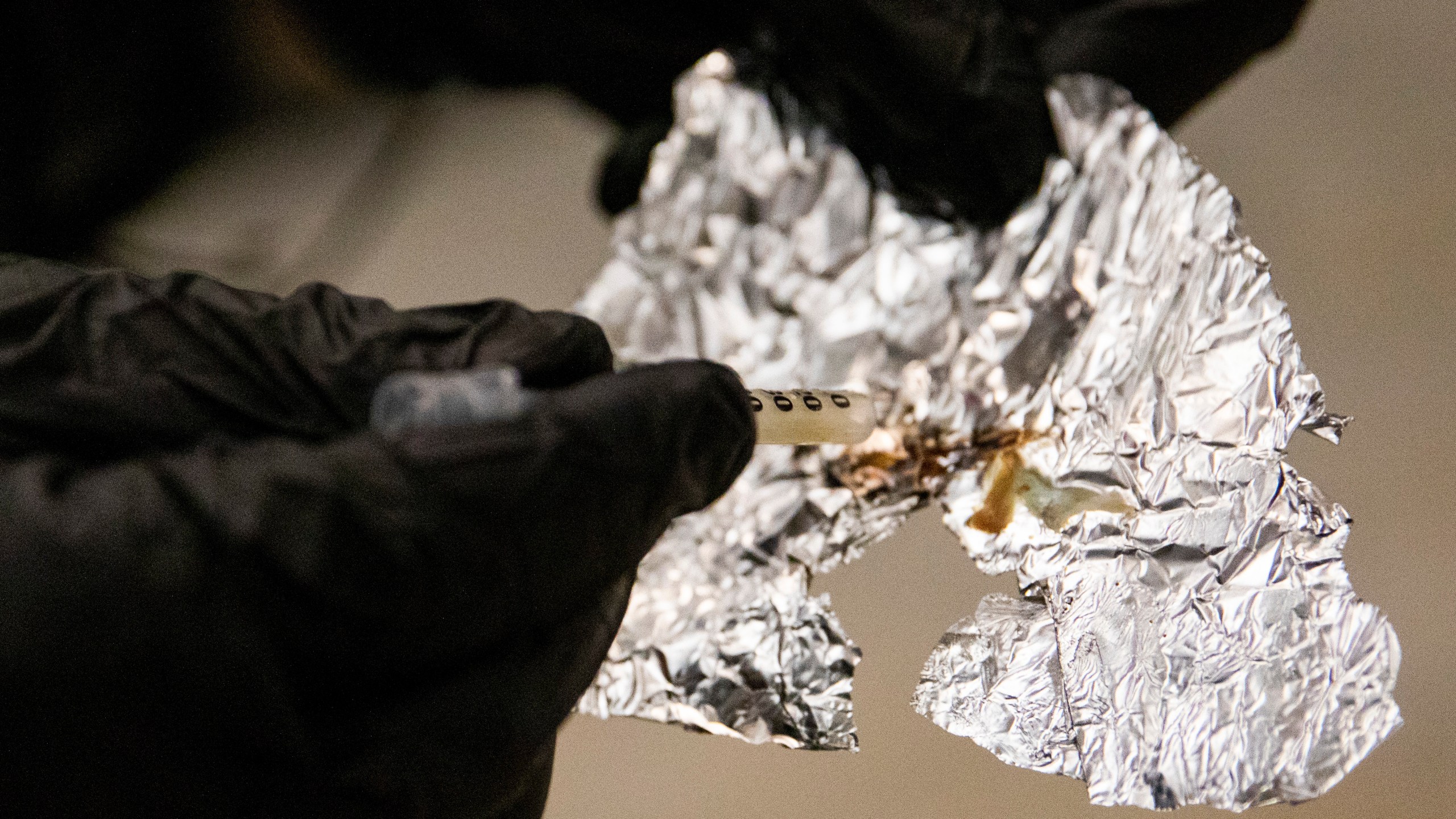 FILE - A BART police officer displays the Fentanyl he confiscated while patrolling the Civic Center Station BART platform in San Francisco, Nov. 20, 2020. An Oregon county's controversial policy that would have distributed tin foil and straws for fentanyl users and glass pipes for methamphetamine and crack users through the health department has been halted. "Our health department went forward with this proposal without proper implementation protocols," Multnomah County Chair Jessica Vega Pederson said in a statement to KGW-TV. (Jessica Christian/San Francisco Chronicle via AP, File)