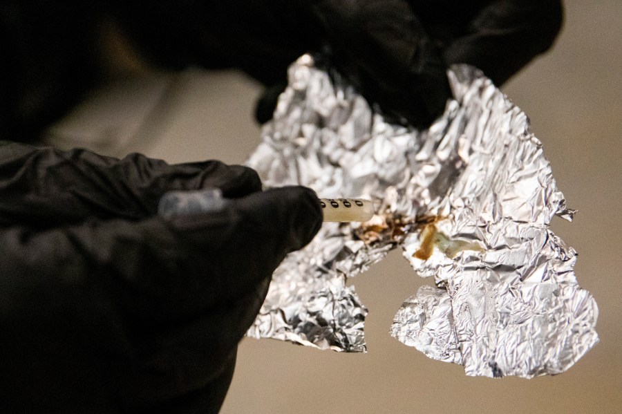 FILE - A BART police officer displays the Fentanyl he confiscated while patrolling the Civic Center Station BART platform in San Francisco, Nov. 20, 2020. An Oregon county's controversial policy that would have distributed tin foil and straws for fentanyl users and glass pipes for methamphetamine and crack users through the health department has been halted. "Our health department went forward with this proposal without proper implementation protocols," Multnomah County Chair Jessica Vega Pederson said in a statement to KGW-TV. (Jessica Christian/San Francisco Chronicle via AP, File)