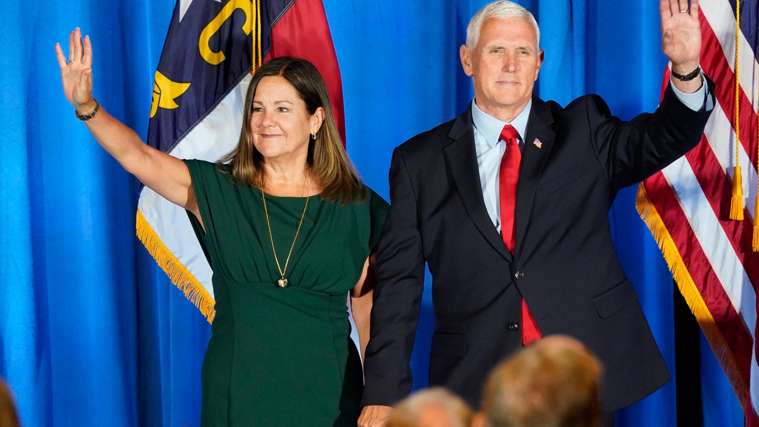 FILE - Republican presidential candidate former Vice President Mike Pence waves on stage with his wife Karen after he spoke during the North Carolina Republican Party Convention in Greensboro, N.C., June 10, 2023. Pence is leaning in on his anti-abortion stance as he campaigns for the Republican presidential nomination. Pence says he does not support exceptions in the case of nonviable pregnancies, when doctors have determined there is no chance a baby will survive outside the womb.(AP Photo/Chuck Burton, File)