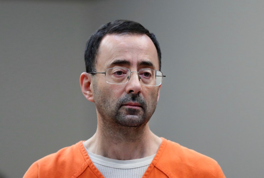 FILE - Disgraced former sports doctor Larry Nassar appears in court for a plea hearing, Nov. 22, 2017, in Lansing, Mich. Nassar was stabbed Sunday, July 9, 2023, in his cell at a federal penitentiary in Florida, out of view of surveillance cameras pointed at common areas and corridors. It’s the second time the ex-U.S. women’s gymnastics team doctor has been assaulted in federal custody while serving decades in prison for sexually abusing athletes. (AP Photo/Paul Sancya, File)