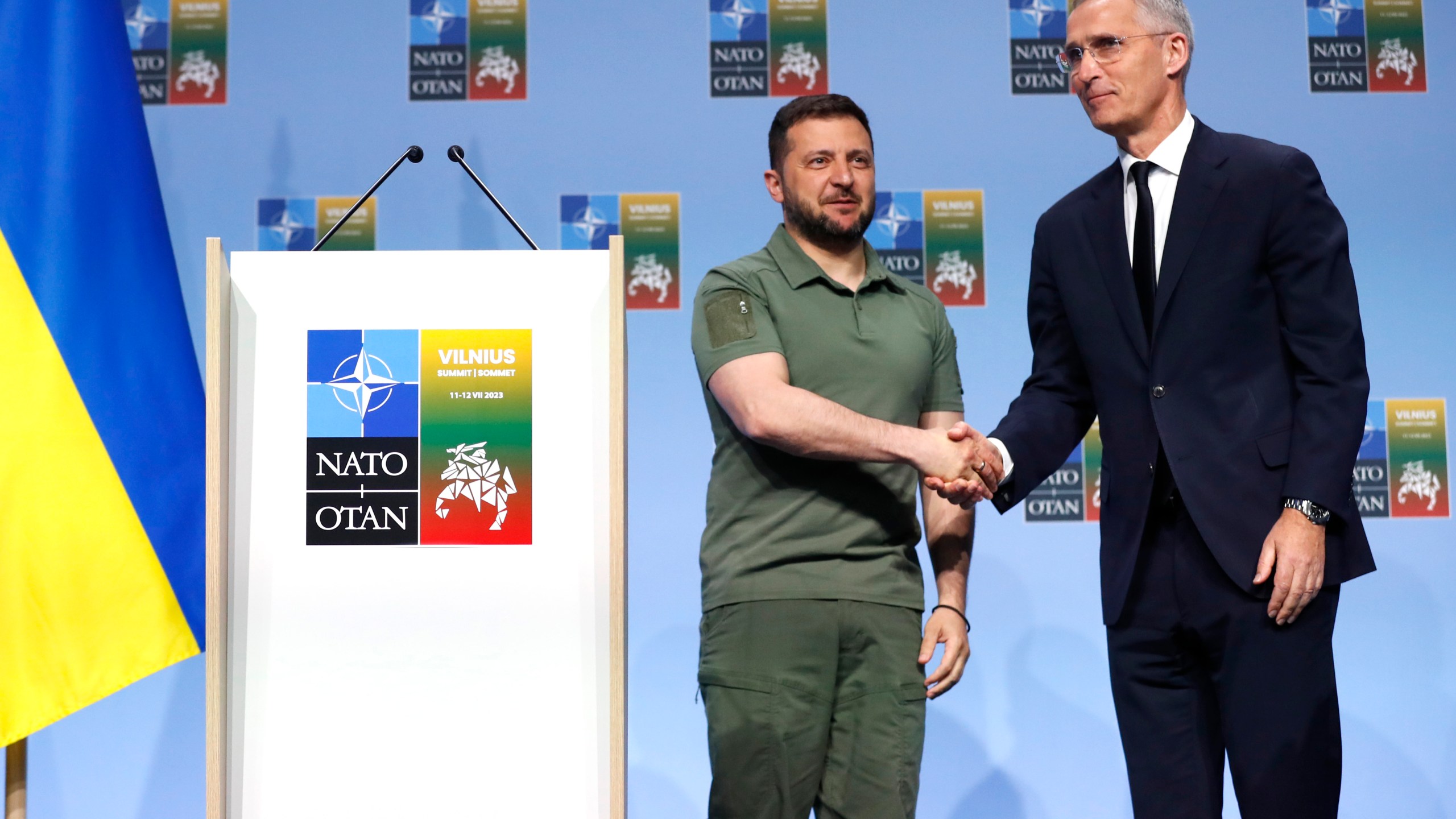 NATO Secretary General Jens Stoltenberg, right, and Ukraine's President Volodymyr Zelenskyy shake hands after addressing a media conference during a NATO summit in Vilnius, Lithuania, Wednesday, July 12, 2023. NATO leaders gathered Wednesday to launch a highly symbolic new forum for ties with Ukraine, after committing to provide the country with more military assistance for fighting Russia but only vague assurances of future membership. (AP Photo/Mindaugas Kulbis)