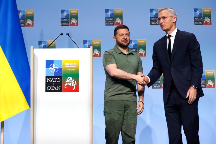 NATO Secretary General Jens Stoltenberg, right, and Ukraine's President Volodymyr Zelenskyy shake hands after addressing a media conference during a NATO summit in Vilnius, Lithuania, Wednesday, July 12, 2023. NATO leaders gathered Wednesday to launch a highly symbolic new forum for ties with Ukraine, after committing to provide the country with more military assistance for fighting Russia but only vague assurances of future membership. (AP Photo/Mindaugas Kulbis)