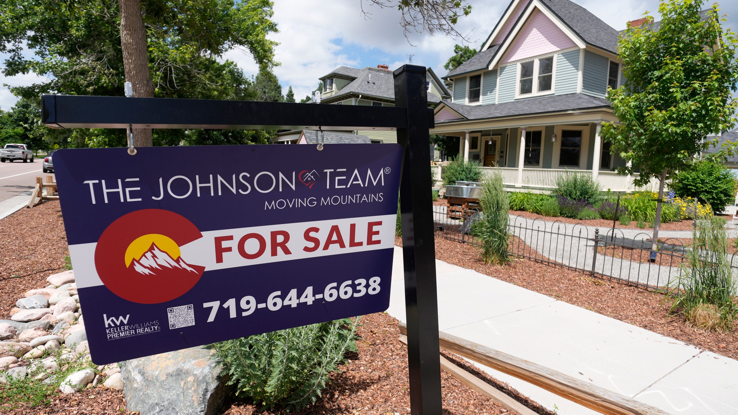 File - A for sale sign stands outside a home on Nevada Avenue Thursday, June 22, 2023, in Colorado Springs, Colo. On Thursday, Freddie Mac reports on this week's average U.S. mortgage rates. (AP Photo/David Zalubowski, File)