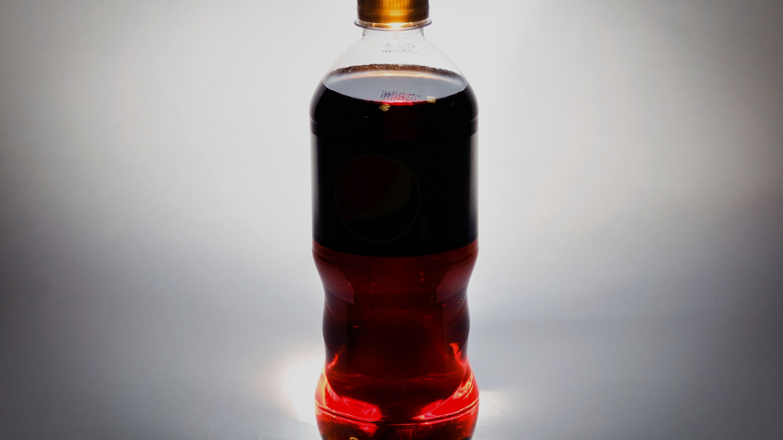 FILE - A bottle of soda is photographed in Washington Thursday, Jan. 23, 2014. On Thursday, July 13, 2023, the International Agency for Research on Cancer, the cancer research arm of the World Health Organization, deemed aspartame, the world’s most widely used artificial sweetener, to be “possibly carcinogenic” to humans. Separately, a U.N. expert group assessing the same evidence said their guidance regarding safe consumption of the sweetener remained unchanged. (AP Photo/J. David Ake, File)