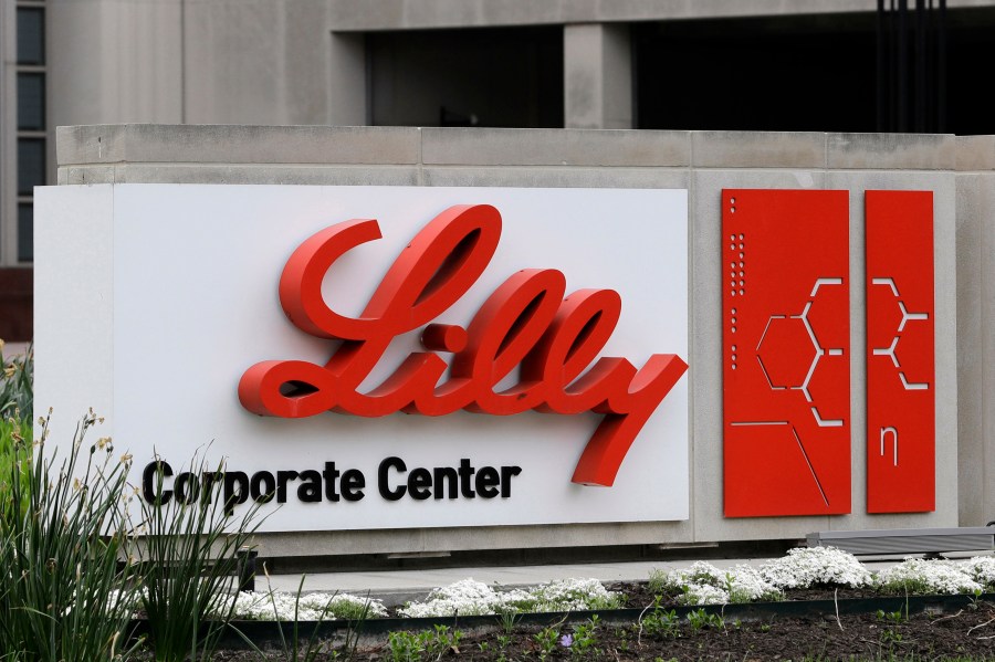 FILE - A sign for Eli Lilly & Co. sits outside their corporate headquarters in Indianapolis on April 26, 2017. New research shows another experimental Alzheimer's drug can modestly slow patients' inevitable worsening. Patients given monthly infusions of Eli Lilly and Co.'s donanemab declined about four to seven months more slowly than those given dummy infusions in a large study. (AP Photo/Darron Cummings, File)